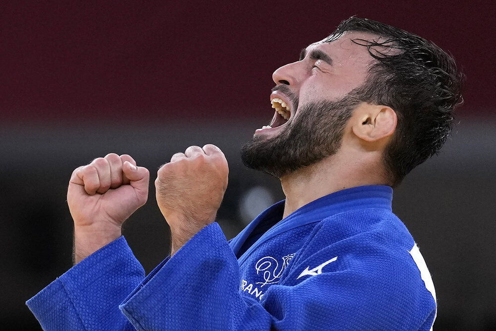  Luka Mkheidze of France reacts after competing against Kim Won-jin of South Korea during their men's -60kg bronze medal judo match at the 2020 Summer Olympics, Saturday, July 24, 2021, in Tokyo, Japan. (AP Photo/Vincent Thian) 