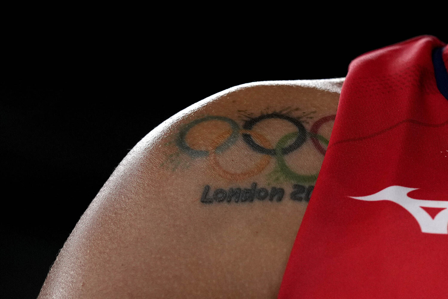  Dominican Republic's Lisvel Elisa Eve Mejia shows a tattoo of Olympic Rings on her shoulder during the women's volleyball preliminary round pool A match between Korea and Dominican Republic at the 2020 Summer Olympics, Thursday, July 29, 2021, in To