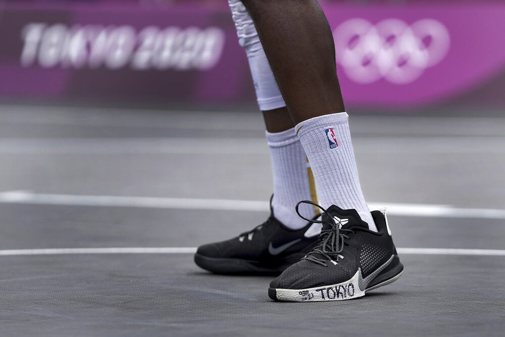  Poland's Michael Hicks has "Tokyo" written on his shoe during a men's 3-on-3 basketball game against Latvia at the 2020 Summer Olympics, Saturday, July 24, 2021, in Tokyo, Japan. (AP Photo/Jeff Roberson) 