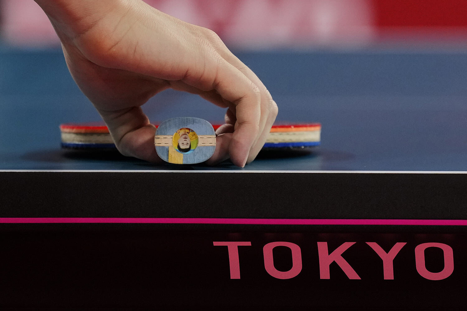  Ma Long of China picks up his racket during a gold medal match of the table tennis men's singles against Fan Zhendong of China at the 2020 Summer Olympics, Friday, July 30, 2021, in Tokyo. (AP Photo/Kin Cheung) 