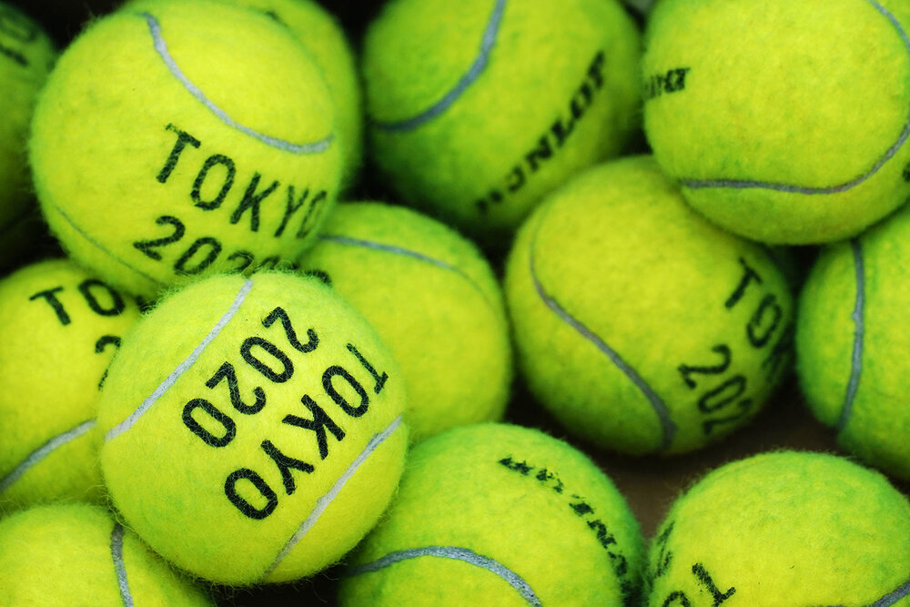  Tennis balls are used for practice at the Ariake Tennis Center ahead of the 2020 Summer Olympics, Thursday, July 22, 2021, in Tokyo, Japan. (AP Photo/Seth Wenig) 