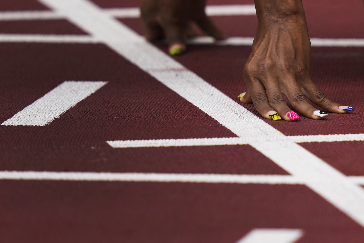  Javianne Oliver, of United States, prepares to start in her heat of the women's 100-meters at the 2020 Summer Olympics, Friday, July 30, 2021, in Tokyo. (AP Photo/Matthias Schrader) 