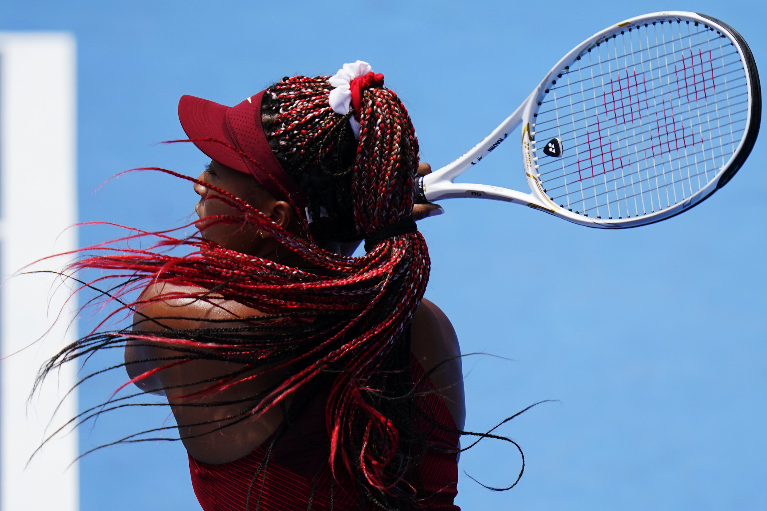  Naomi Osaka, of Japan, serves to Viktorija Golubic, of Switzerland, during second round of the tennis competition at the 2020 Summer Olympics, Monday, July 26, 2021, in Tokyo, Japan. (AP Photo/Patrick Semansky) 
