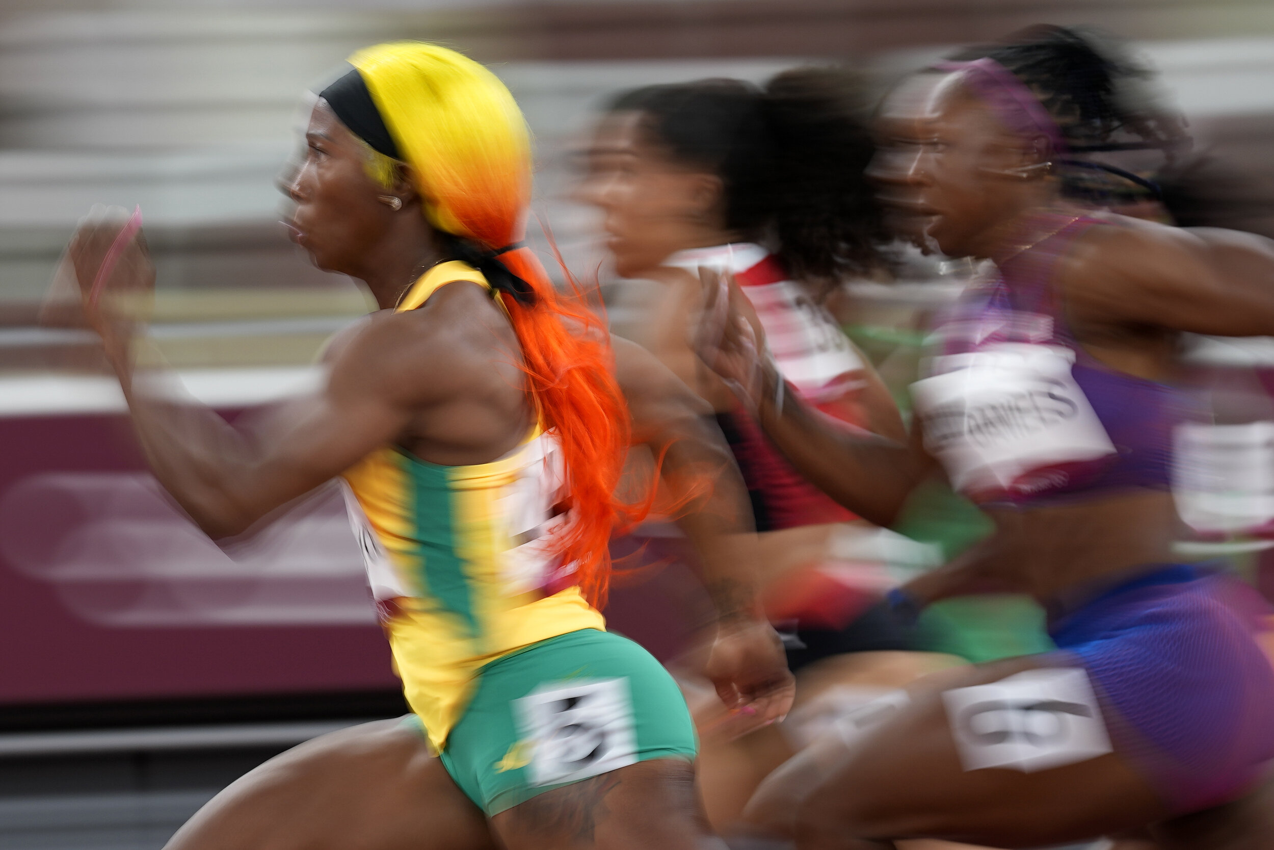  Shelly-Ann Fraser-Pryce, of Jamaica, runs in a semifinal of the women's 100-meters at the 2020 Summer Olympics, Saturday, July 31, 2021, in Tokyo. (AP Photo/David J. Phillip) 