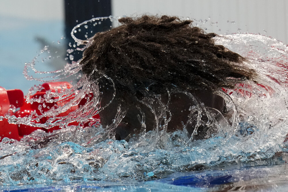  Edgar Richardson Iro, of Solomon Islands, shakes water out of his hair after a heat of the men's 100-meter freestyle at the 2020 Summer Olympics, Tuesday, July 27, 2021, in Tokyo, Japan. (AP Photo/Petr David Josek) 