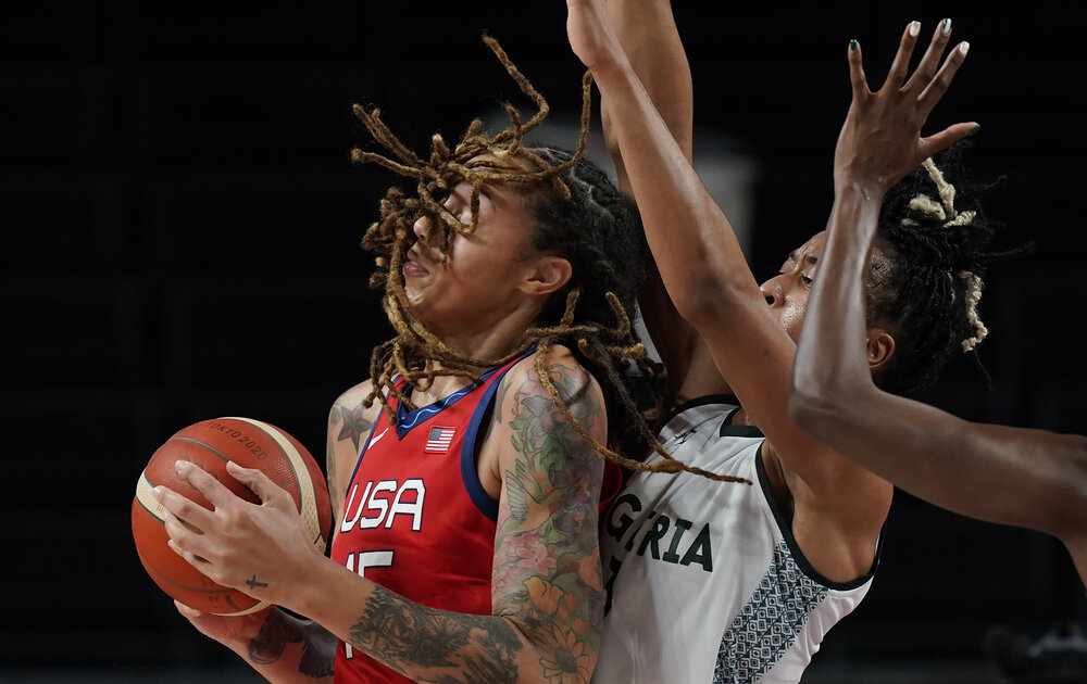  United States' Brittney Griner (15), left, attempts to shoot past Nigeria's Pallas Kunaiyi-Akpanah (3), right, during women's basketball preliminary round game at the 2020 Summer Olympics, Tuesday, July 27, 2021, in Saitama, Japan. (AP Photo/Eric Ga