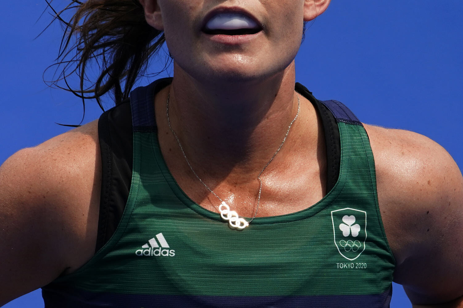  Ireland midfield Lizzy Holden (14) wears a necklace with the Olympic Rings during a women's field hockey match against India at the 2020 Summer Olympics, Friday, July 30, 2021, in Tokyo, Japan. (AP Photo/John Locher) 