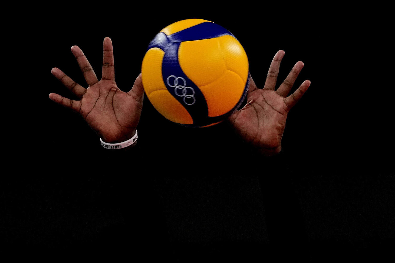  The hands of Kenya's Sharon Chepchumba Kiprono block the ball during the women's volleyball preliminary round pool A match between Dominican Republic and Kenya at the 2020 Summer Olympics, Saturday, July 31, 2021, in Tokyo, Japan. (AP Photo/Frank Au
