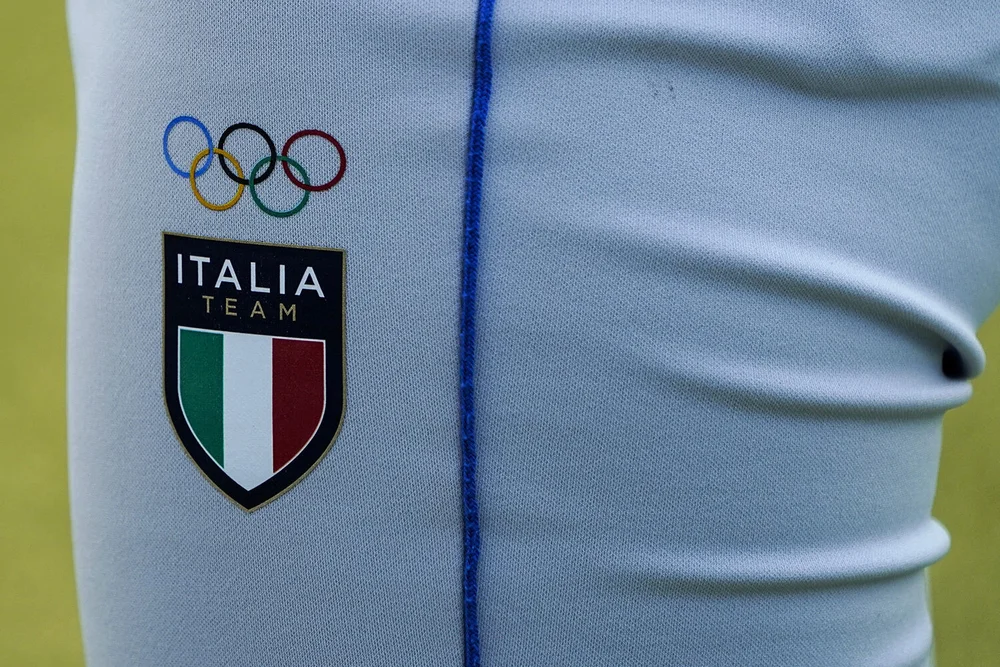  The Olympic rings are printed on the uniform of an Italian softball player during a training session at the Fukushima Azuma Baseball Stadium ahead of the 2020 Summer Olympics, Tuesday, July 20, 2021, in Fukushima, Japan. (AP Photo/Jae C. Hong) 