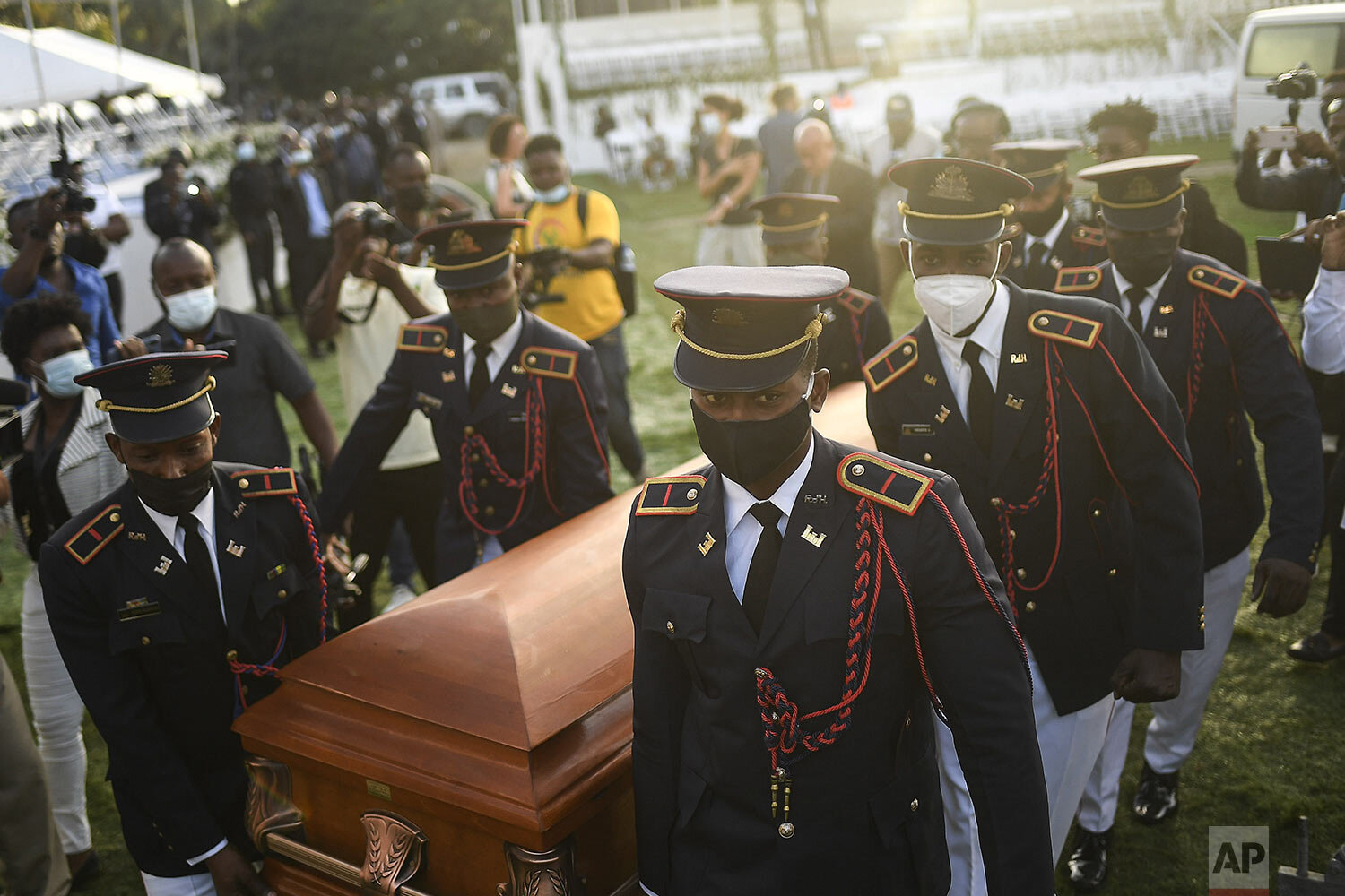  Police carry the coffin of slain Haitian President Jovenel Moise at the start of the funeral at his family home in Cap-Haitien, Haiti, early Friday, July 23, 2021. Moise was assassinated at his home in Port-au-Prince on July 7. (AP Photo/Matias Dela