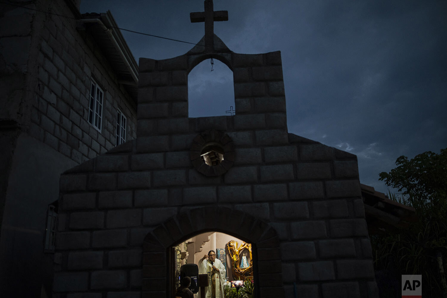  Friar Leopoldo Serrano celebrates Mass, broadcast via Facebook, at a chapel in Mission San Francisco de Asis, Honduras, late Saturday, June 19, 2021. Located on the border of the departments of Santa Barbara and Copan, his sprawling mission straddle