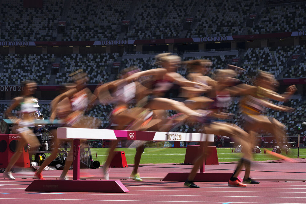 Runners compete in a heat of the women's 3,000-meter steeplechase at the 2020 Summer Olympics, Sunday, Aug. 1, 2021, in Tokyo. (AP Photo/Petr David Josek) 
