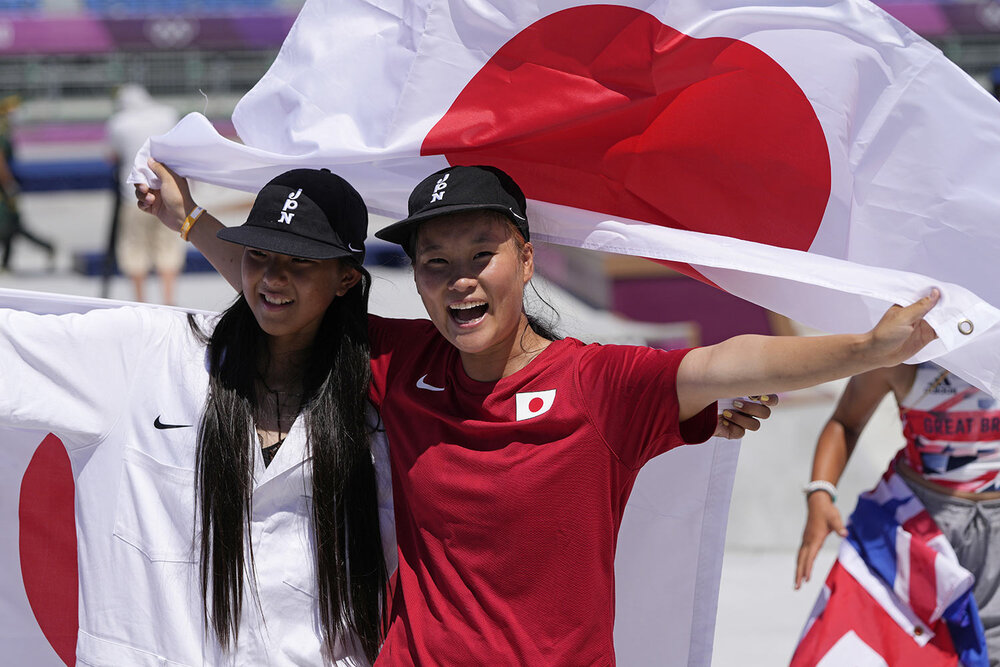  Gold medal winner Sakura Yosozumi, right, and silver medalist Kokona Hiraki, both of Japan, celebrate after the women's park skateboarding finals at the 2020 Summer Olympics, Wednesday, Aug. 4, 2021, in Tokyo, Japan. (AP Photo/Ben Curtis) 