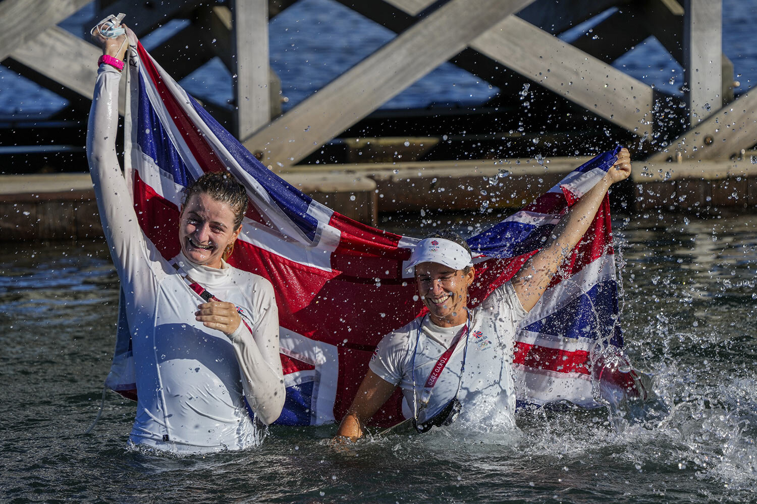  Great Britain's Hanna Mills, right, and Eilidh Mcintyre celebrate after winning the 470 women's gold medal during the 2020 Summer Olympics, Wednesday, Aug. 4, 2021, in Fujisawa, Japan. (AP Photo/Bernat Armangue) 