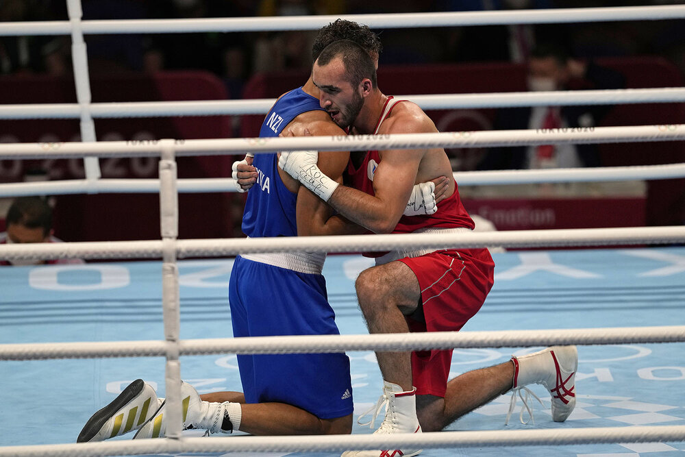  Russian Olympic Committee's Muslim Gadzhimagomedov, right, hugs New Zealand's David Nyika after winning their men's heavyweight 91-kg semifinal boxing match at the 2020 Summer Olympics, Tuesday, Aug. 3, 2021, in Tokyo, Japan. (AP Photo/Themba Hadebe