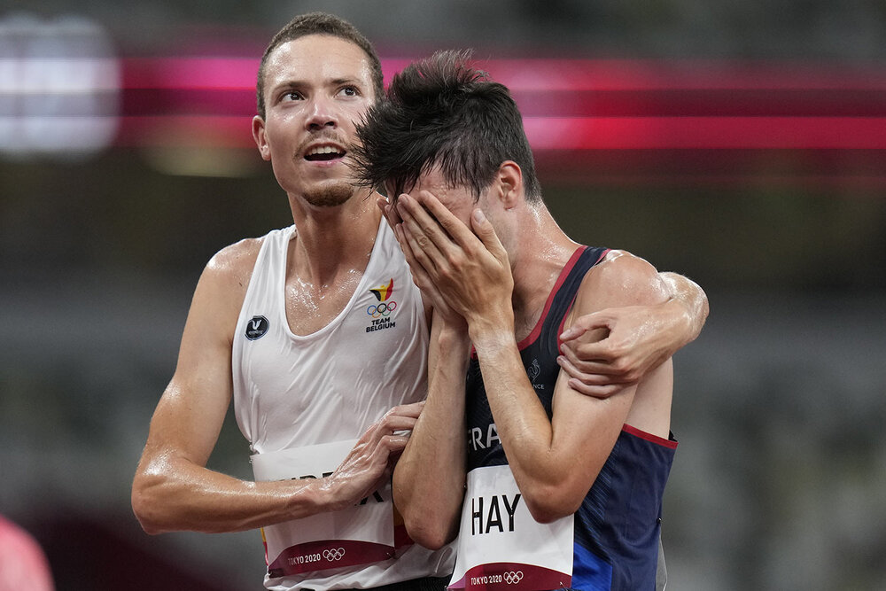  Robin Hendrix, of Belgium, left, embraces Hugo Hay, of France, after their men's 5,000-meters at the 2020 Summer Olympics, Tuesday, Aug. 3, 2021, in Tokyo. (AP Photo/Petr David Josek) 