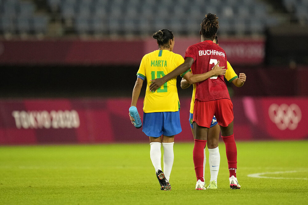  Canada's Kadeisha Buchanan, right, embraces Brazil's Marta at the end of a women's quarterfinal soccer match at the 2020 Summer Olympics, Friday, July 30, 2021, in Rifu, Japan. Canada won 4-3 in a penalty shootout. (AP Photo/Andre Penner) 