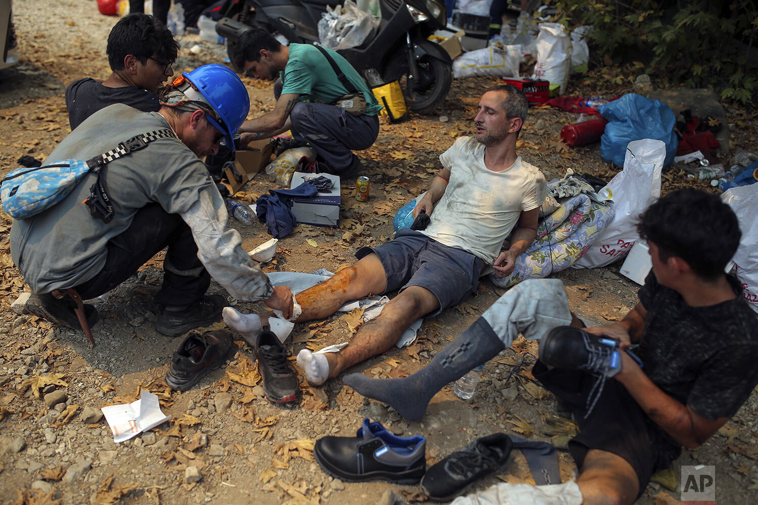  Turkish volunteers rest as they fight wildfires in Turgut village, near tourist resort of Marmaris, Mugla, Turkey, Wednesday, Aug. 4, 2021. As Turkish fire crews pressed ahead Tuesday with their weeklong battle against blazes tearing through forests