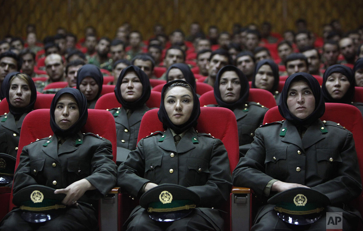  Newly trained female officers from the Afghan National Army sit in front seats as a new batch of officers attend their graduation ceremony at National Army's training center in Kabul, Afghanistan, Thursday, Sept. 23, 2010. (AP Photo/Gemunu Amarasing