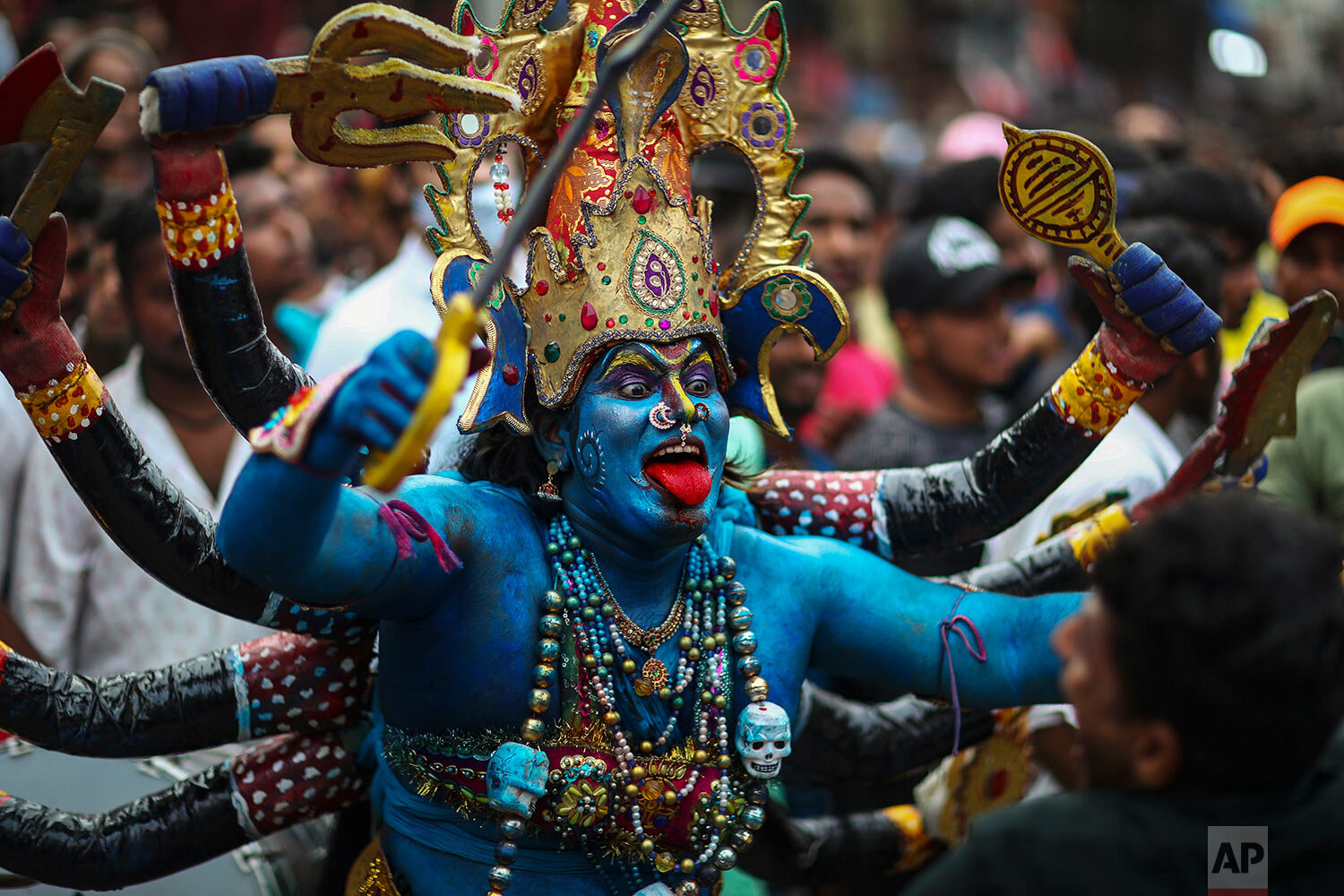  A devotee dressed like Kali dances during the Bonalu festival in Hyderabad, India, Sunday, Aug. 1, 2021.  (AP Photo/Mahesh Kumar A.) 