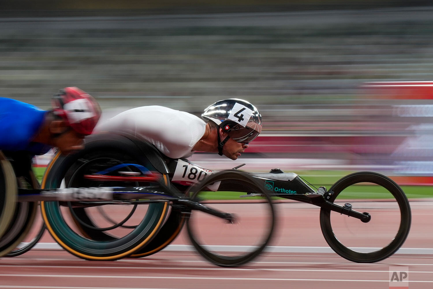  Switzerland's Marcel Hug, competes in the men's T54 5000-meters final during the 2020 Paralympics at the National Stadium in Tokyo, Saturday, Aug. 28, 2021. (AP Photo/Eugene Hoshiko) 