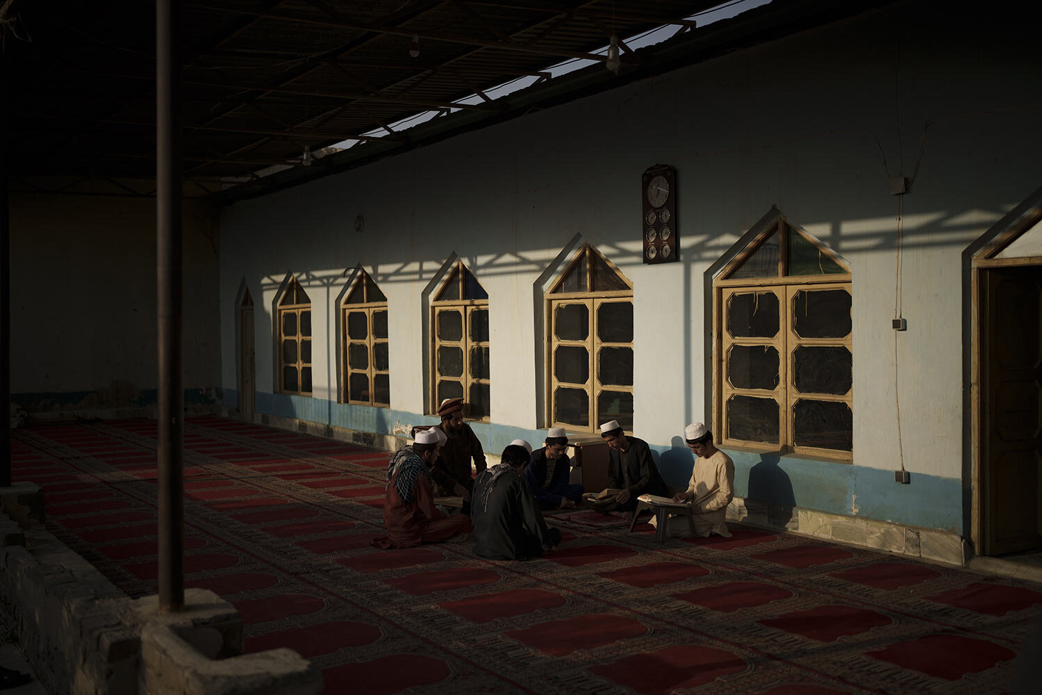 Afghan students read the Quran, Islam's holy book, at a madrasa in Kabul, Afghanistan, Sept. 28, 2021. (AP Photo/Felipe Dana)