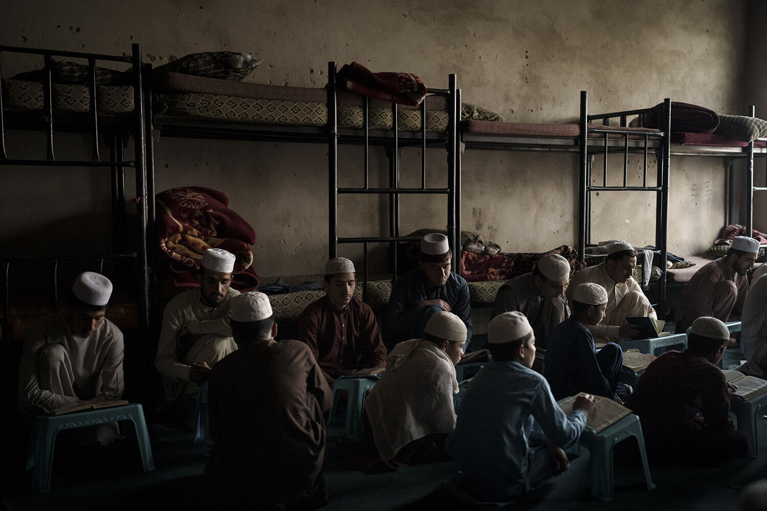 Afghan boys read the Quran, Islam's holy book, during class at the Khatamul Anbiya madrasa in Kabul, Afghanistan, Wednesday, Sept. 29, 2021. (AP Photo/Felipe Dana)