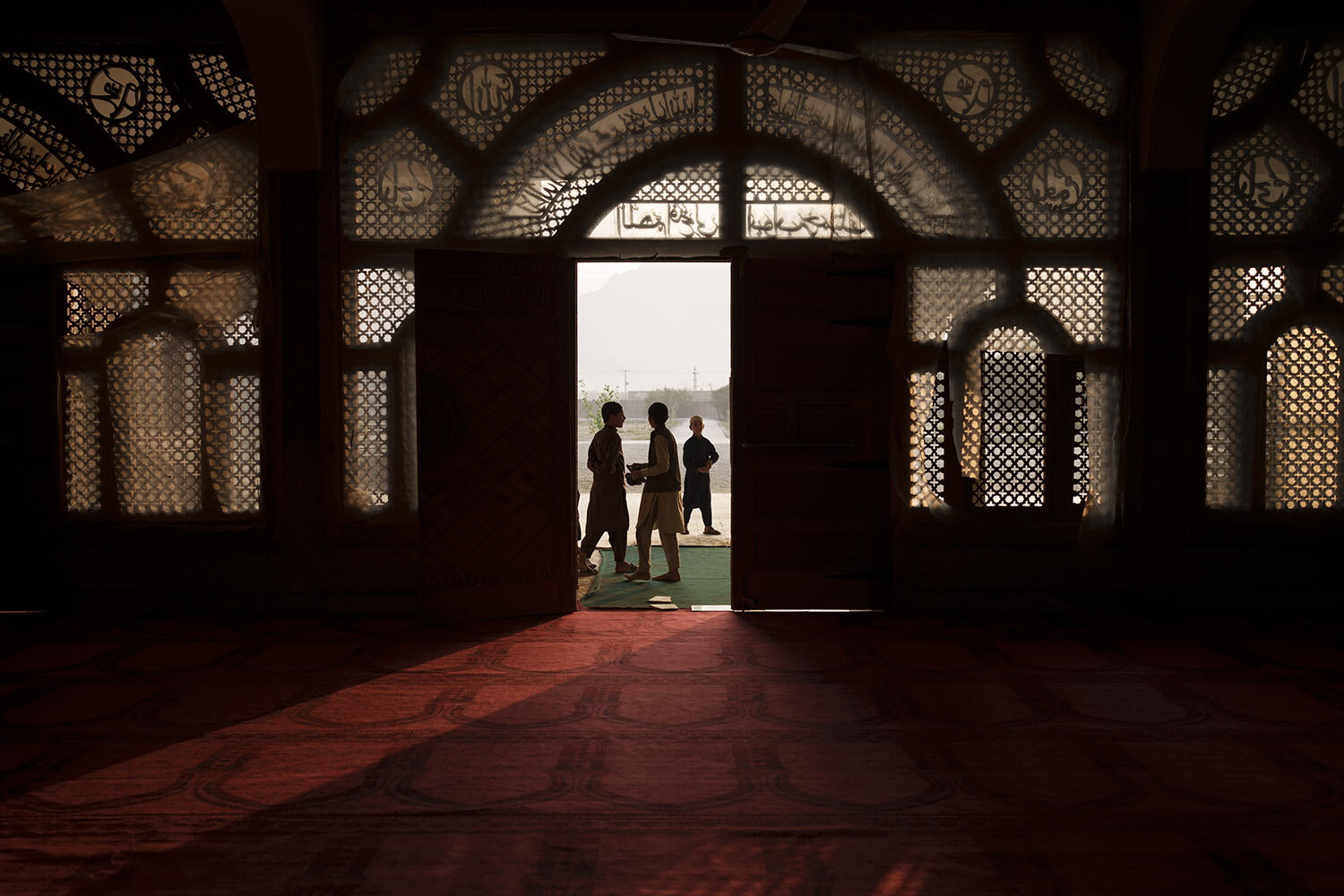 Afghan students walk out of the mosque at the Khatamul Anbiya madrasa after morning prayers in Kabul, Afghanistan, Wednesday, Sept. 29, 2021. (AP Photo/Felipe Dana)