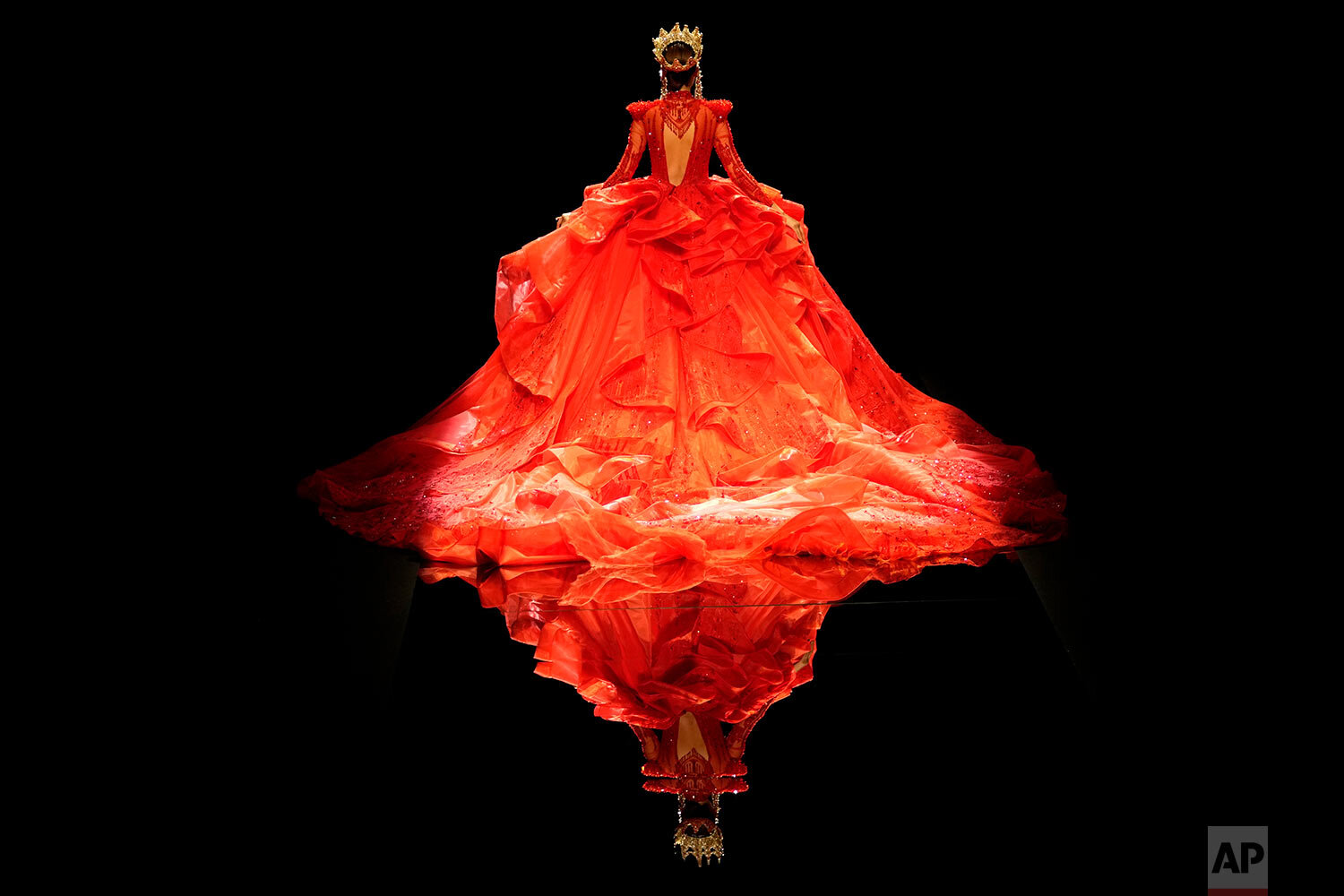  A model presents a gown from the William Zhang collection by designer Hongwei Zhang during the China Fashion Week held in Beijing, China, Wednesday, Sept. 8, 2021. (AP Photo/Ng Han Guan) 