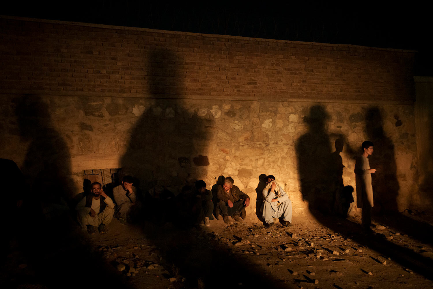  The shadow of Taliban fighters casts over drug users detained at a police station in Kabul, Afghanistan, Friday, Oct. 1, 2021. (AP Photo/Felipe Dana) 