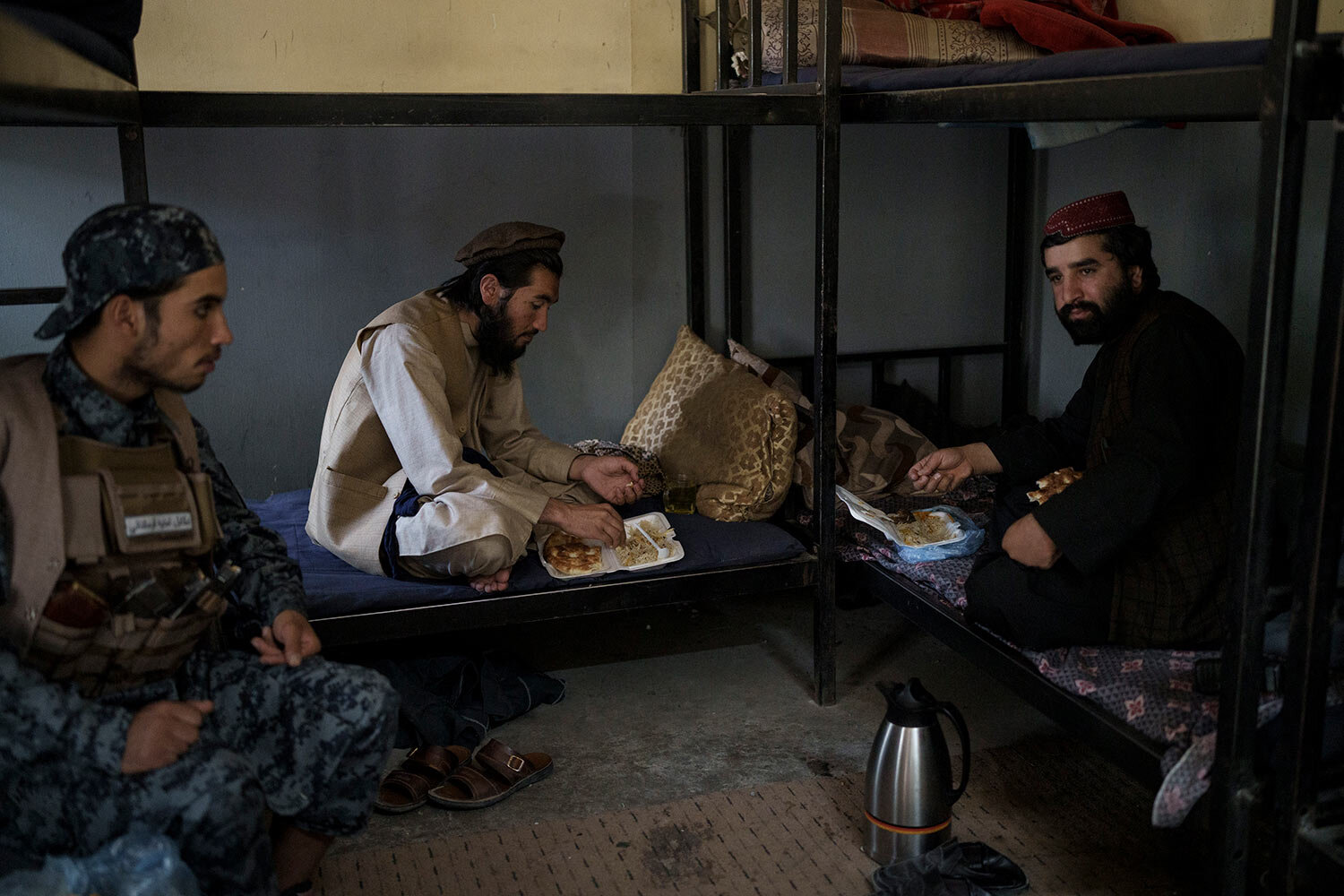  Taliban fighters eat lunch at a police station in Kabul, Afghanistan, Wednesday, Sept. 15, 2021. (AP Photo/Felipe Dana)  