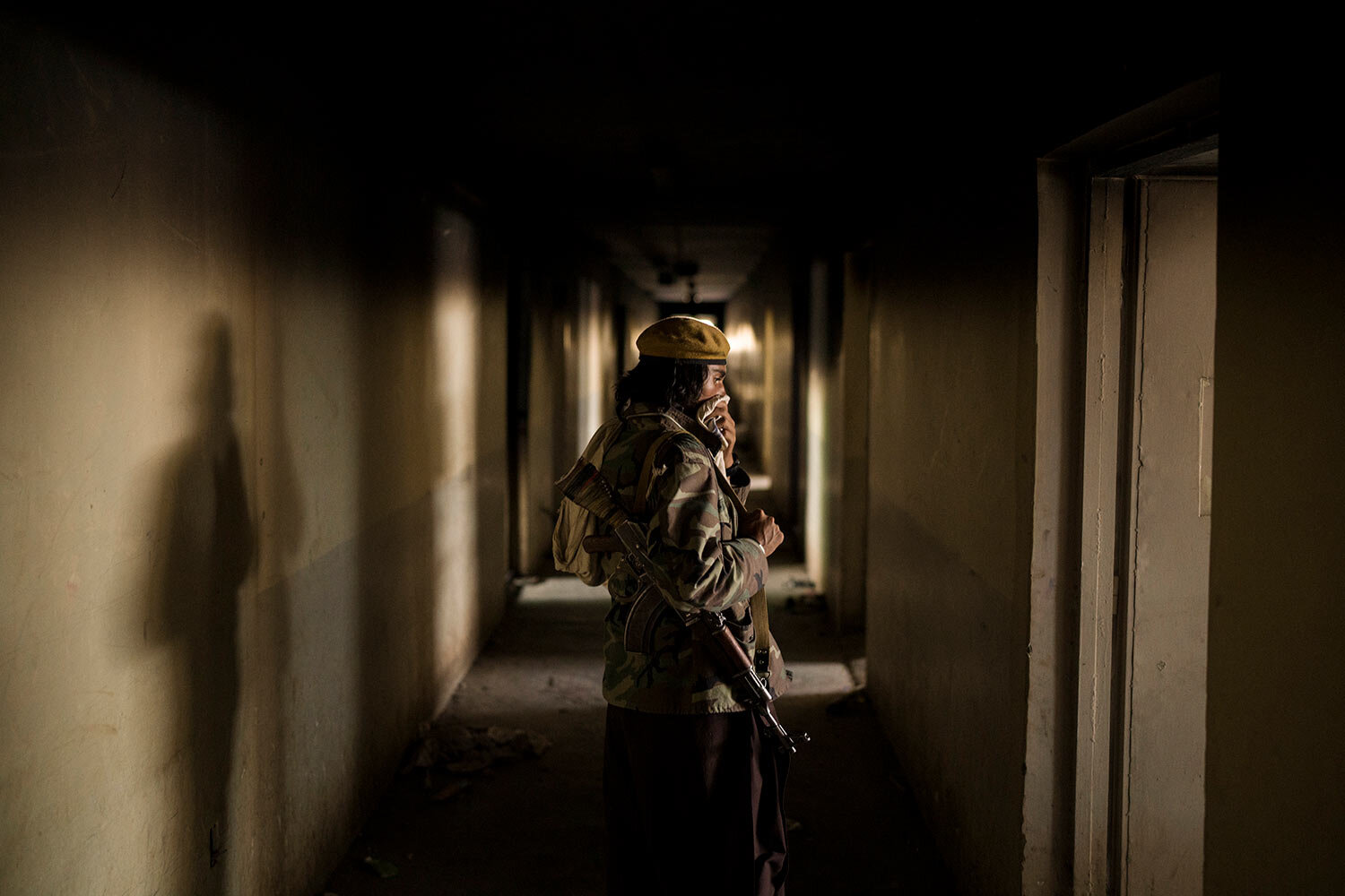  A Taliban fighter covers his nose as he walks inside an abandoned area of the Pul-e-Charkhi prison in Kabul, Afghanistan, Monday, Sept. 13, 2021. (AP Photo/Felipe Dana)  
