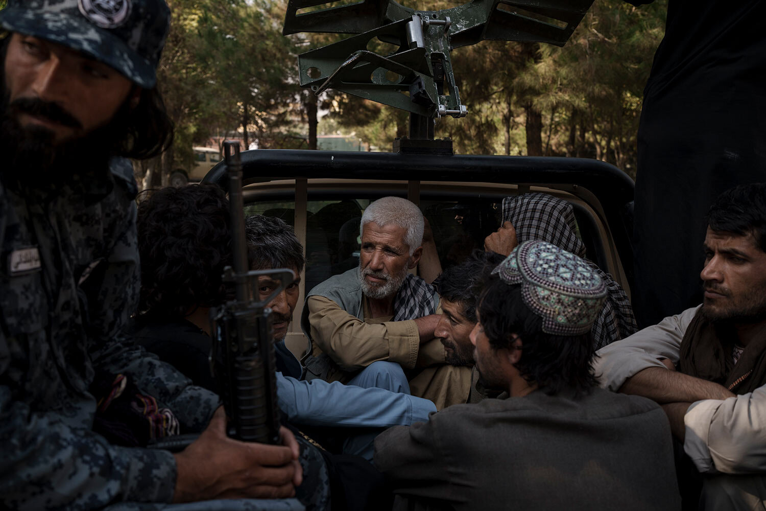  Afghan detainees sit in the back of a vehicle as they are transferred by Taliban police to a court in Kabul, Afghanistan, Sunday, Sept. 19, 2021. (AP Photo/Felipe Dana)  