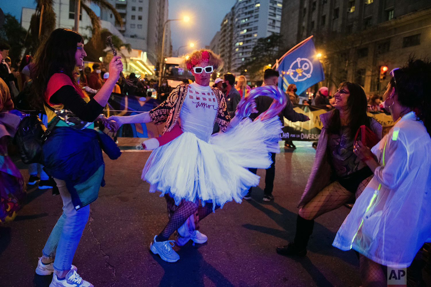  A person in costume strikes a pose during a diversity parade in Montevideo, Uruguay, Sept. 24, 2021. The annual event aims to raise awareness and fight discrimination based on sexual identity and orientation. (AP Photo/Matilde Campodonico) 