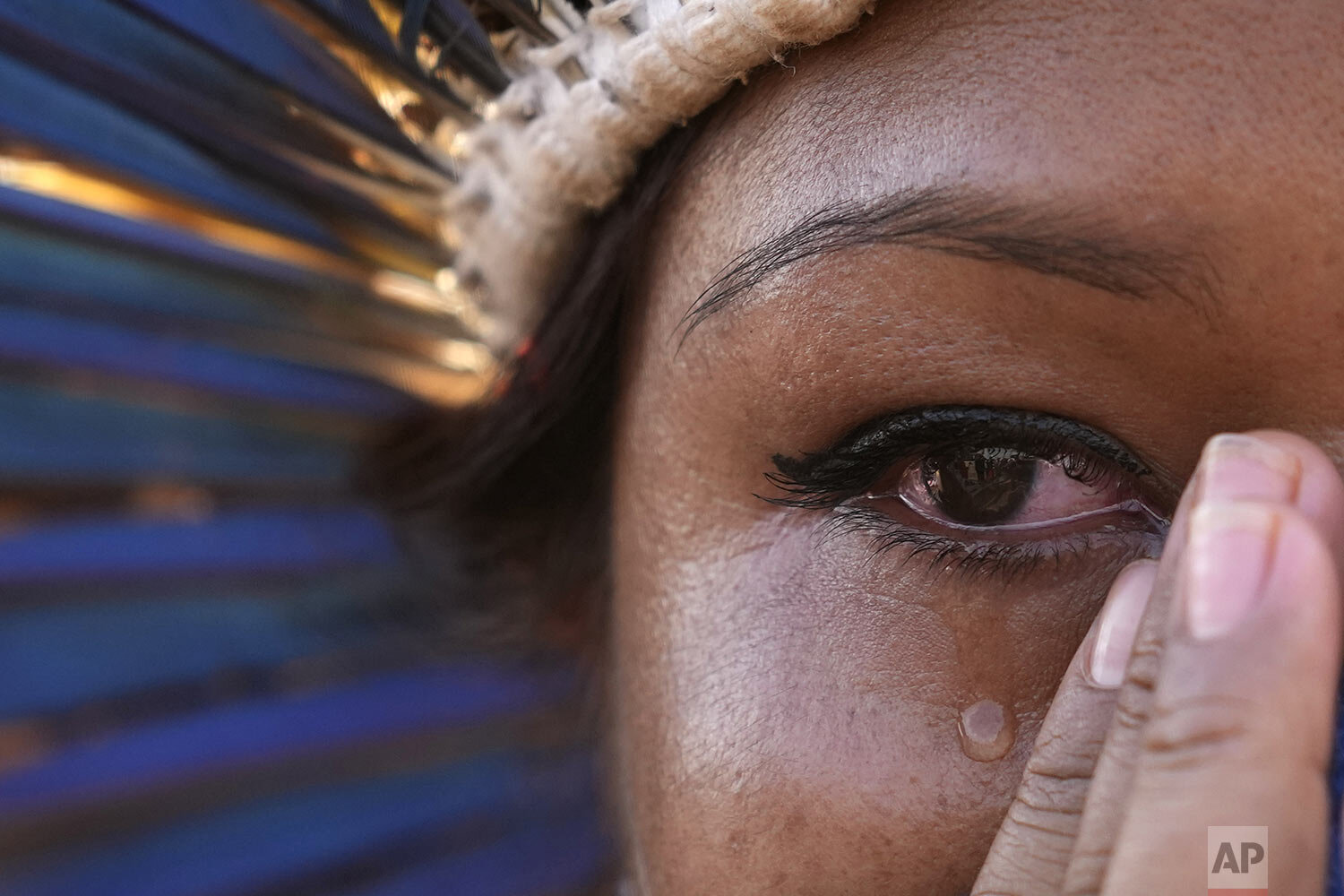  An Indigenous woman cries after judges suspended the vote on demarcating Indigenous lands, outside the Supreme Court in Brasilia, Brazil, Sept. 15, 2021. (AP Photo/Eraldo Peres) 