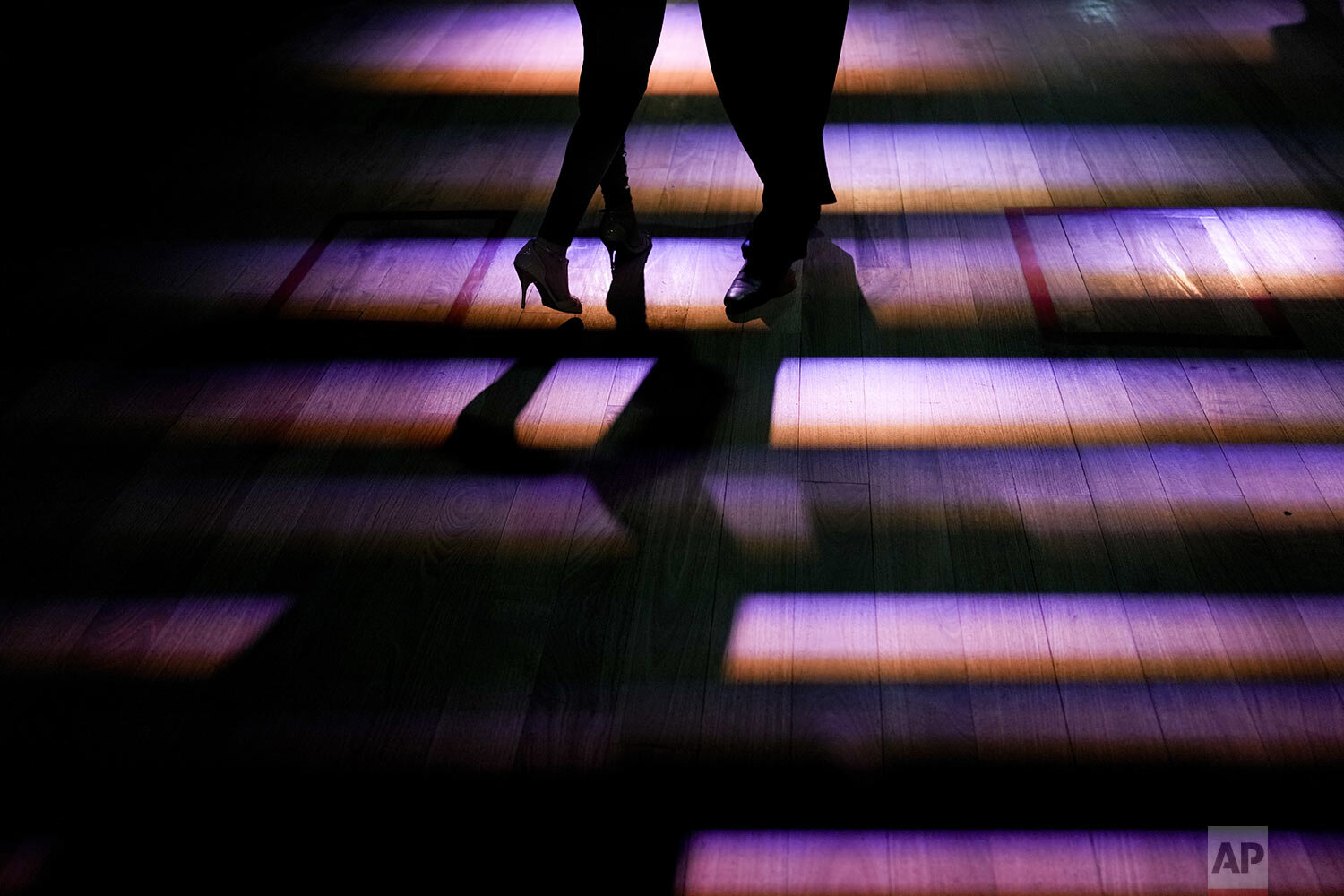  A couple dances tango at a milonga venue in Buenos Aires, Argentina, Sept. 23, 2021. (AP Photo/Natacha Pisarenko) 
