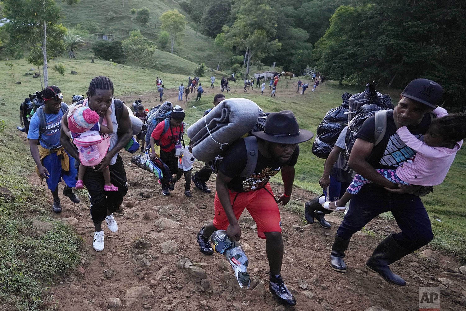  Migrants, mostly Haitians, continue their trek north, near Acandi, Colombia, Sept. 15, 2021. The migrants are on their way to crossing the Darien Gap from Colombia into Panama, ton their way to the U.S. (AP Photo/Fernando Vergara) 