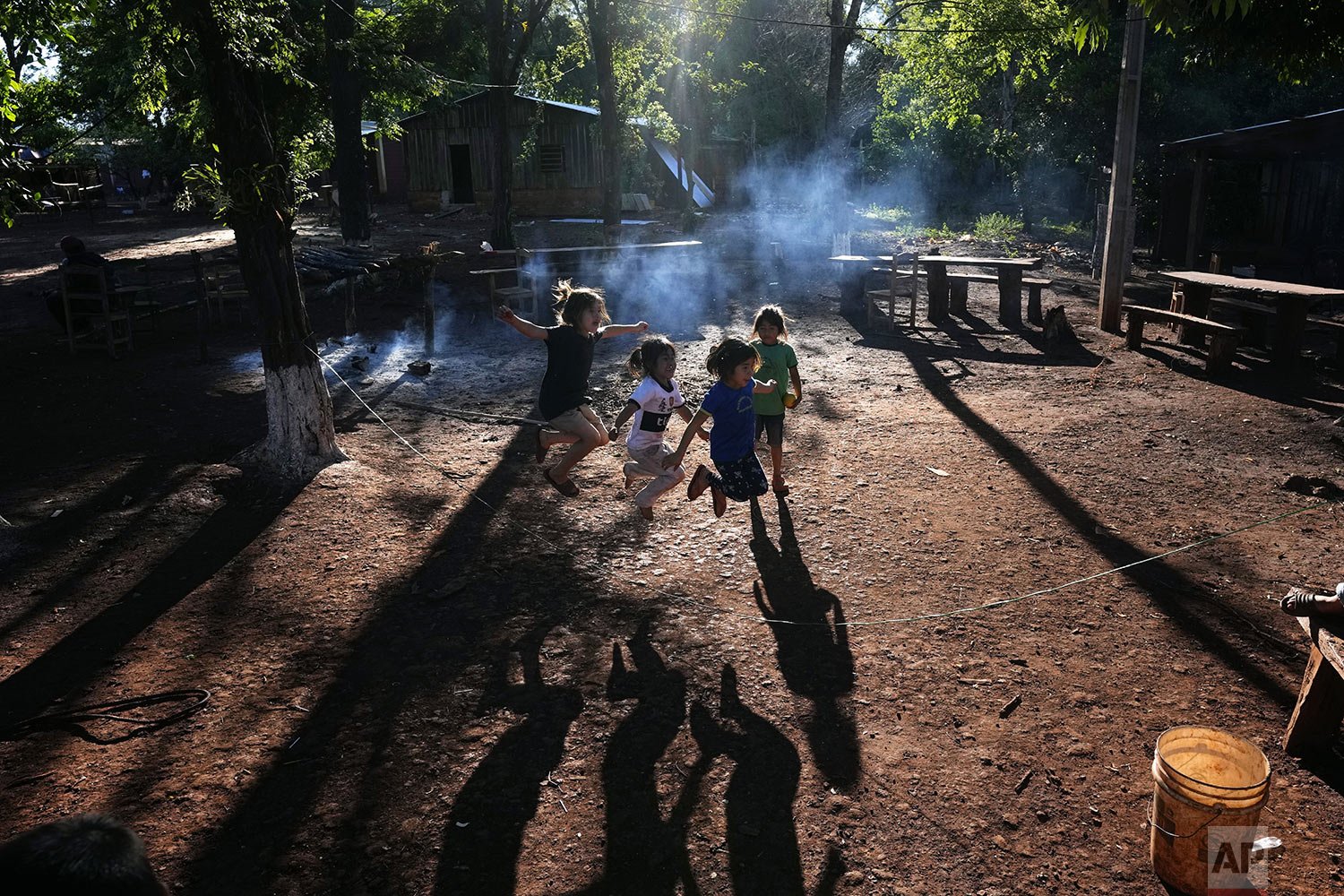  Children jump rope in the Ache Indigenous town of Puerto Barra during celebrations marking the town's 45th anniversary, in the Alto Parana department of Paraguay, Oct. 24, 2021. The town's original inhabitants left their jungle community, Naranjal, 