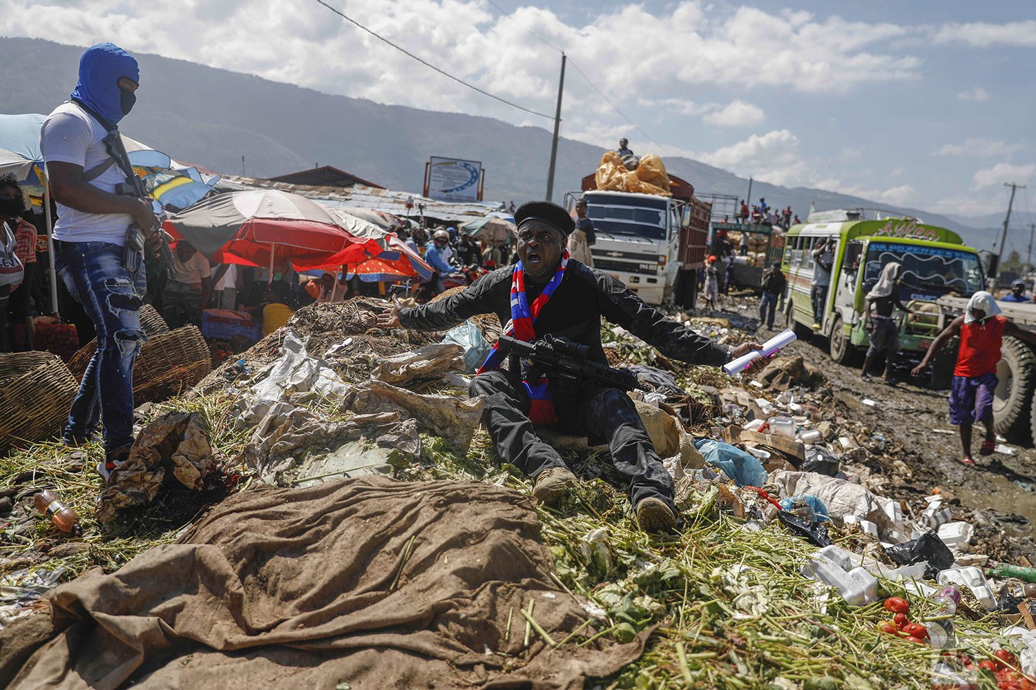  Jimmy Cherizier, aka Barbecue, a former policeman who leads the G9 gang coalition, sits on a pile of garbage to call attention to the conditions people live in as he leads a march against kidnapping and for better conditions for the poor, through La