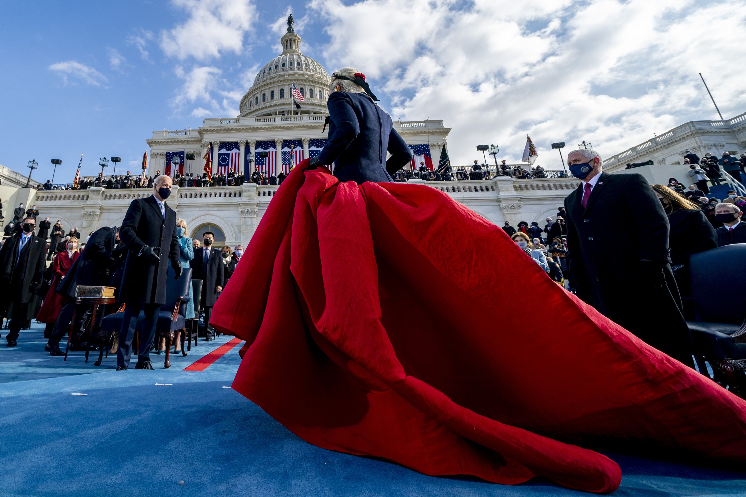  President-elect Joe Biden, left, and Vice President Mike Pence, right, watch as Lady Gaga steps off the stage after performing the national anthem during the 59th Presidential Inauguration at the U.S. Capitol in Washington, on Jan. 20, 2021. (AP Pho