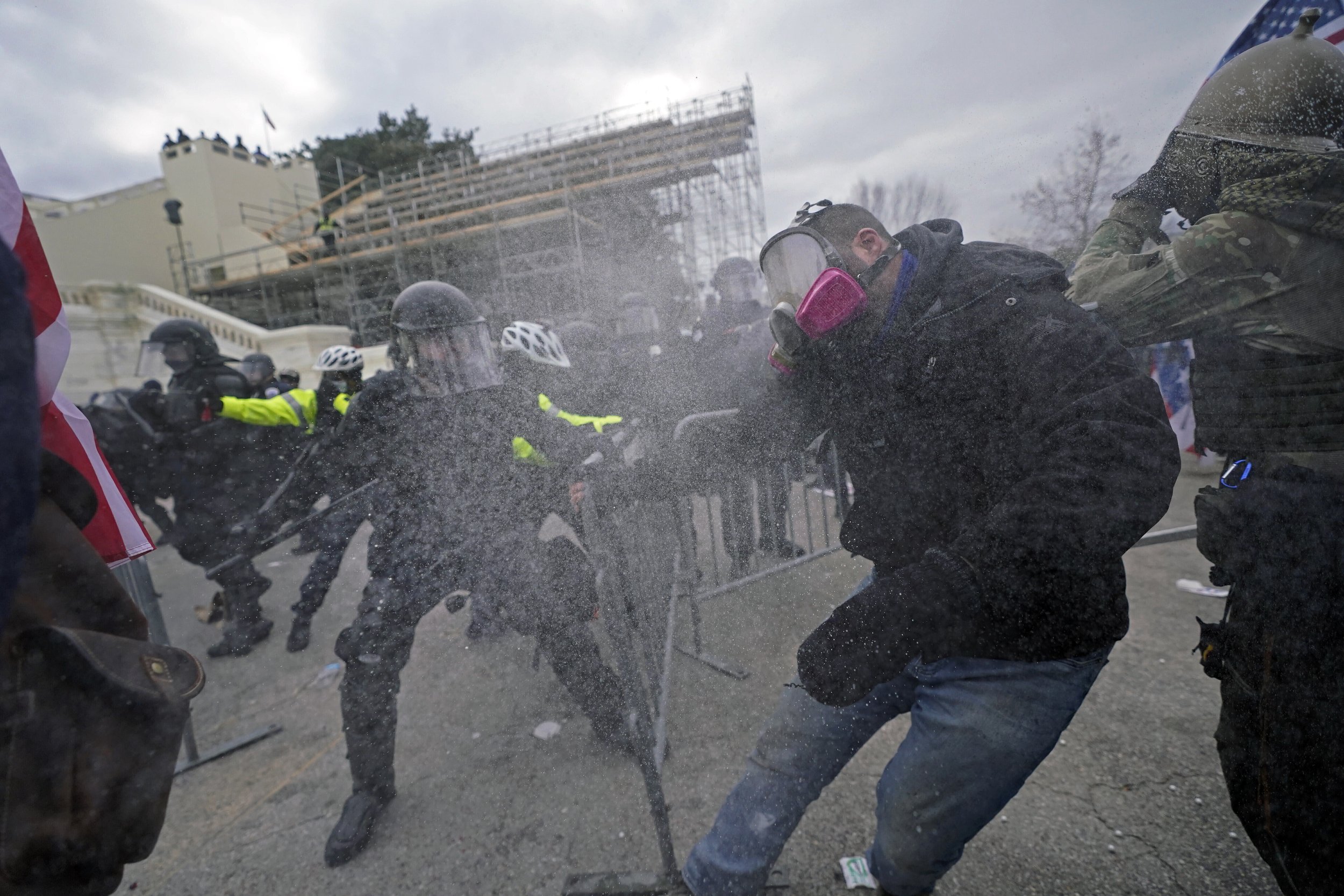  Supporters of President Donald Trump try to break through a police barrier at the Capitol in Washington on Jan. 6, 2021, as Congress prepared to affirm President-elect Joe Biden's victory. (AP Photo/Julio Cortez) 