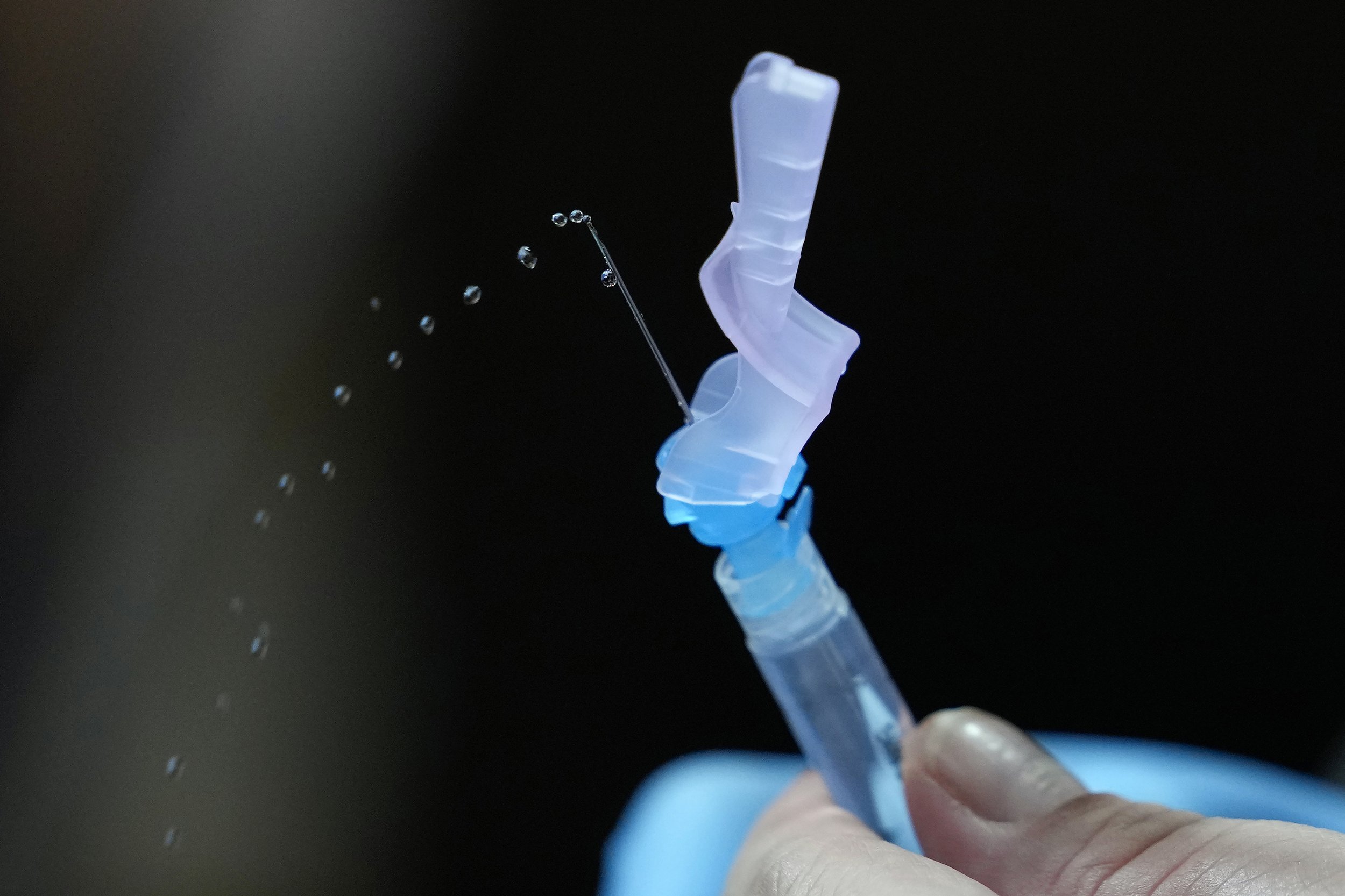 A health worker prepares Pfizer's COVID-19 vaccine at the National Kidney and Transplant Institute in Quezon City, Philippines, on Nov. 17, 2021. (AP Photo/Aaron Favila) 