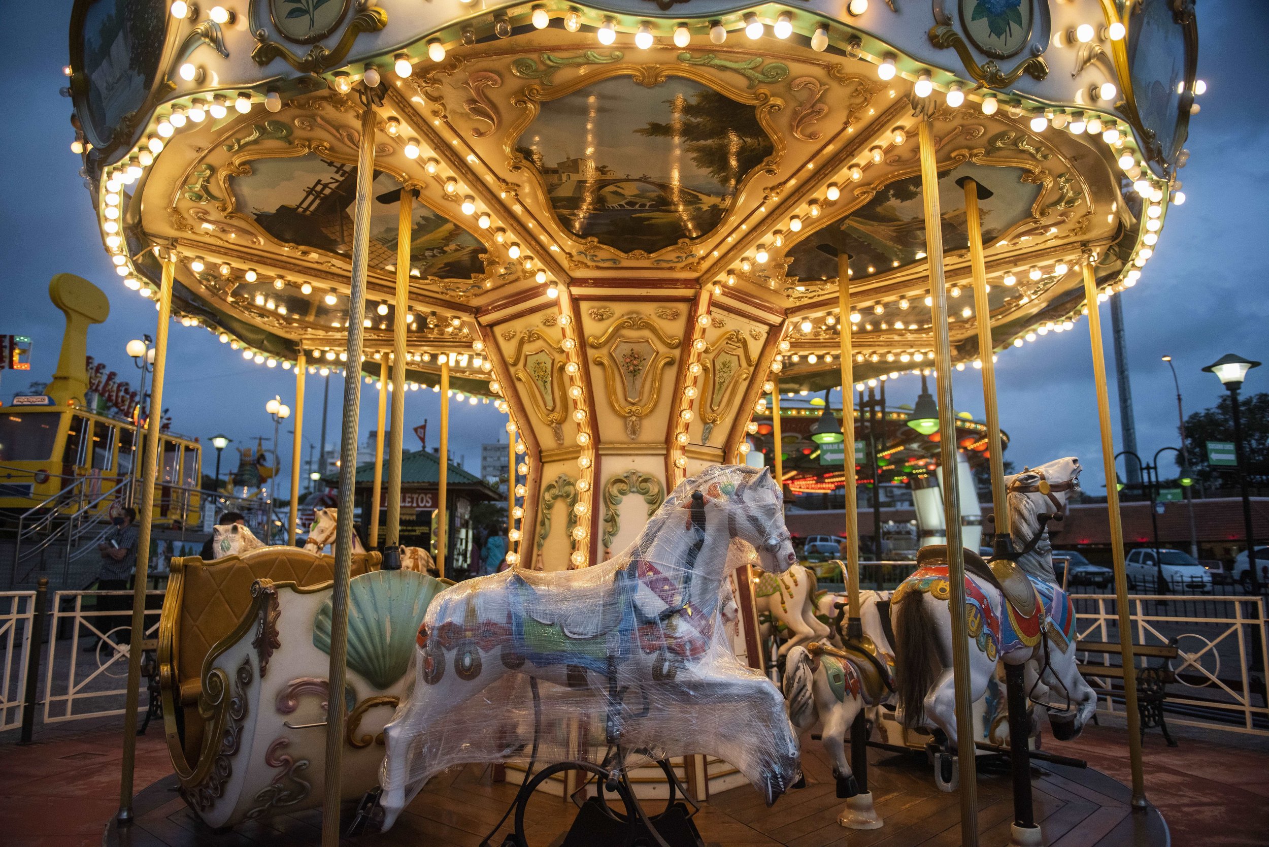  A horse is wrapped in plastic on a merry-go-round at a park open for business during the COVID-19 pandemic in Montevideo, Uruguay, on Jan. 31, 2021. (AP Photo/Matilde Campodonico) 