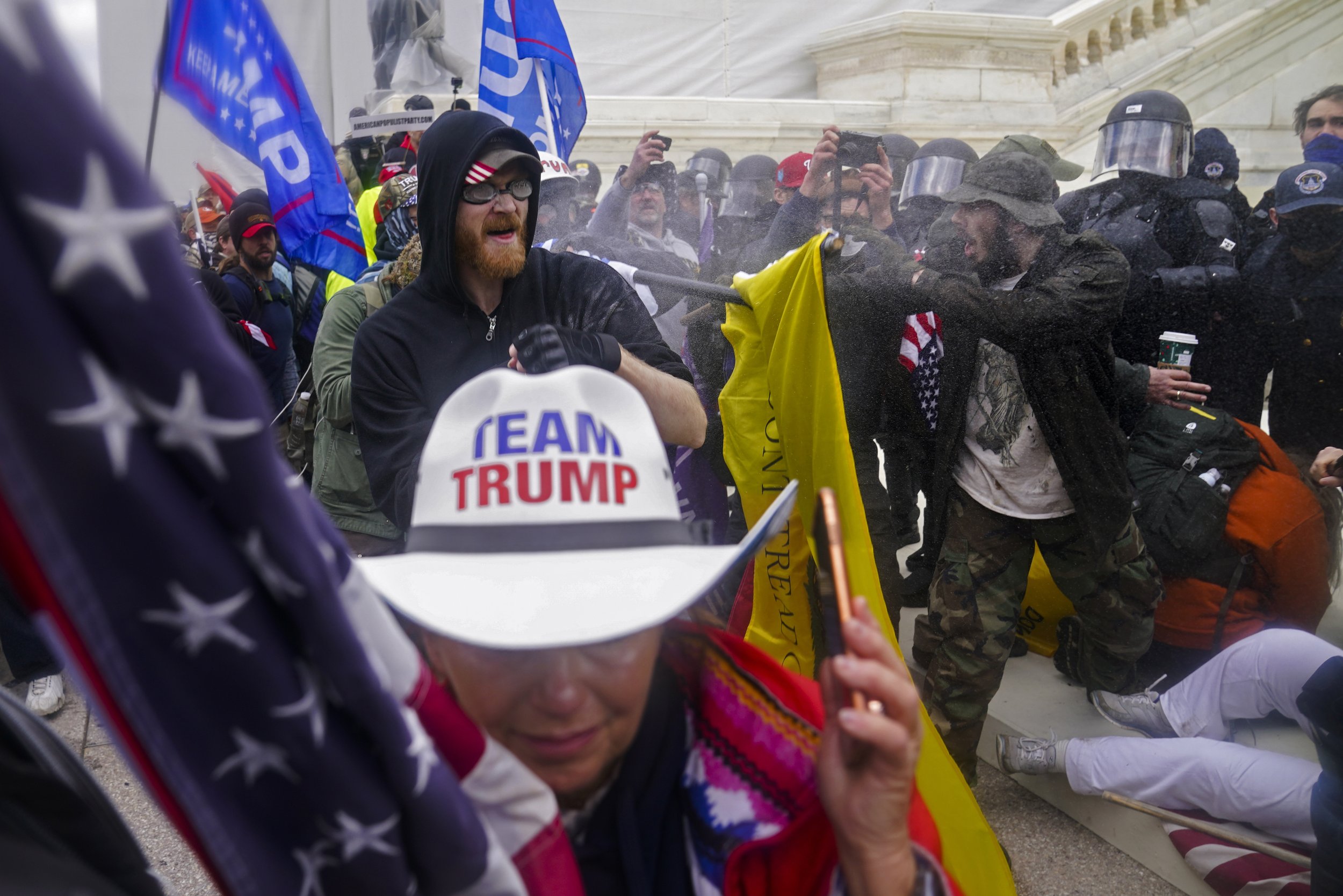  Trump supporters try to break through a police barrier at the Capitol in Washington, on Jan. 6, 2021, as Congress prepared to affirm President-elect Joe Biden's victory. (AP Photo/John Minchillo) 