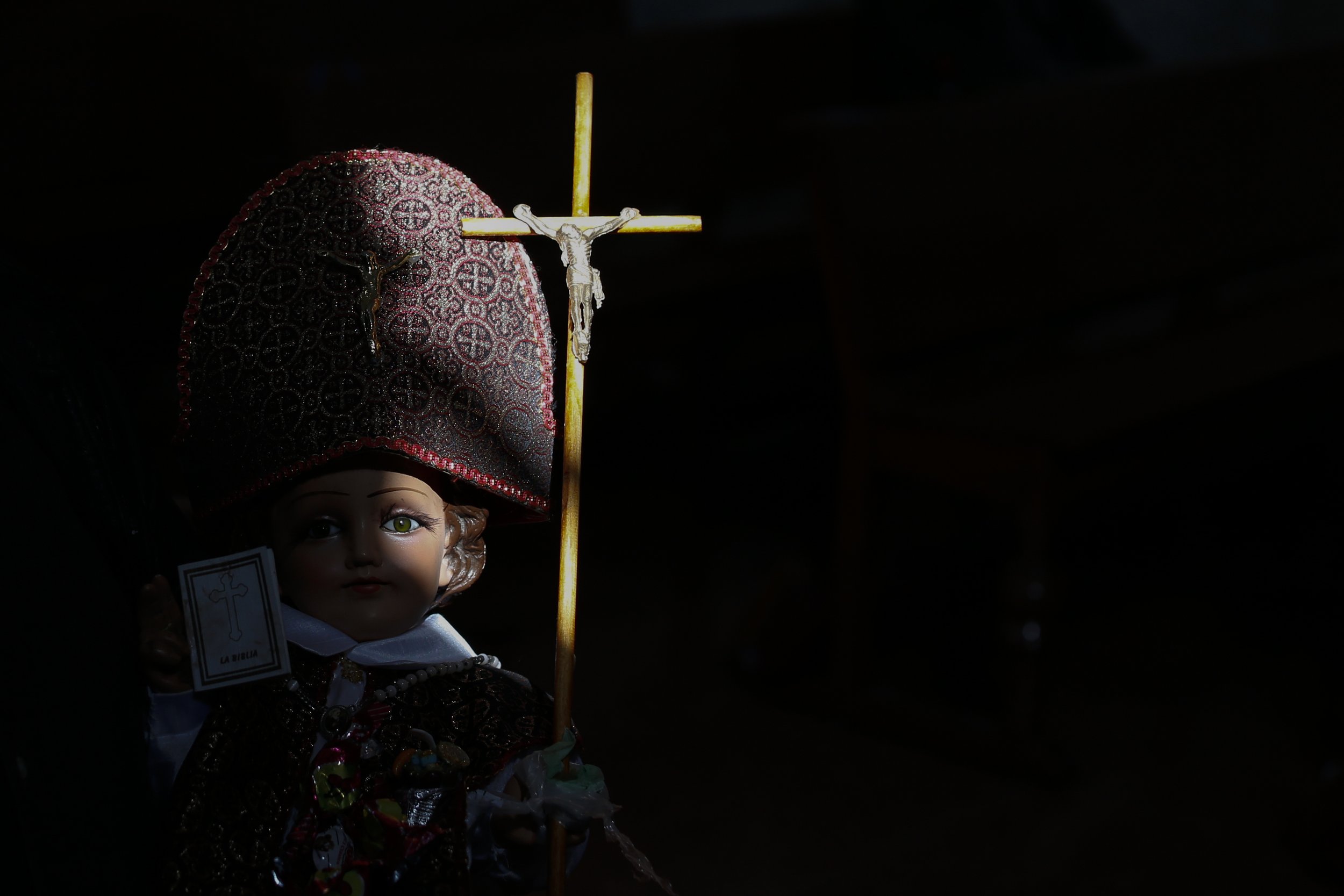  A ray of sunshine illuminates the face of a baby Jesus figure, held by a man waiting to have the figurine blessed, at the Purification of Our Lady of Candlemas Chapel in Mexico City, on Feb. 2, 2021. (AP Photo/Rebecca Blackwell) 