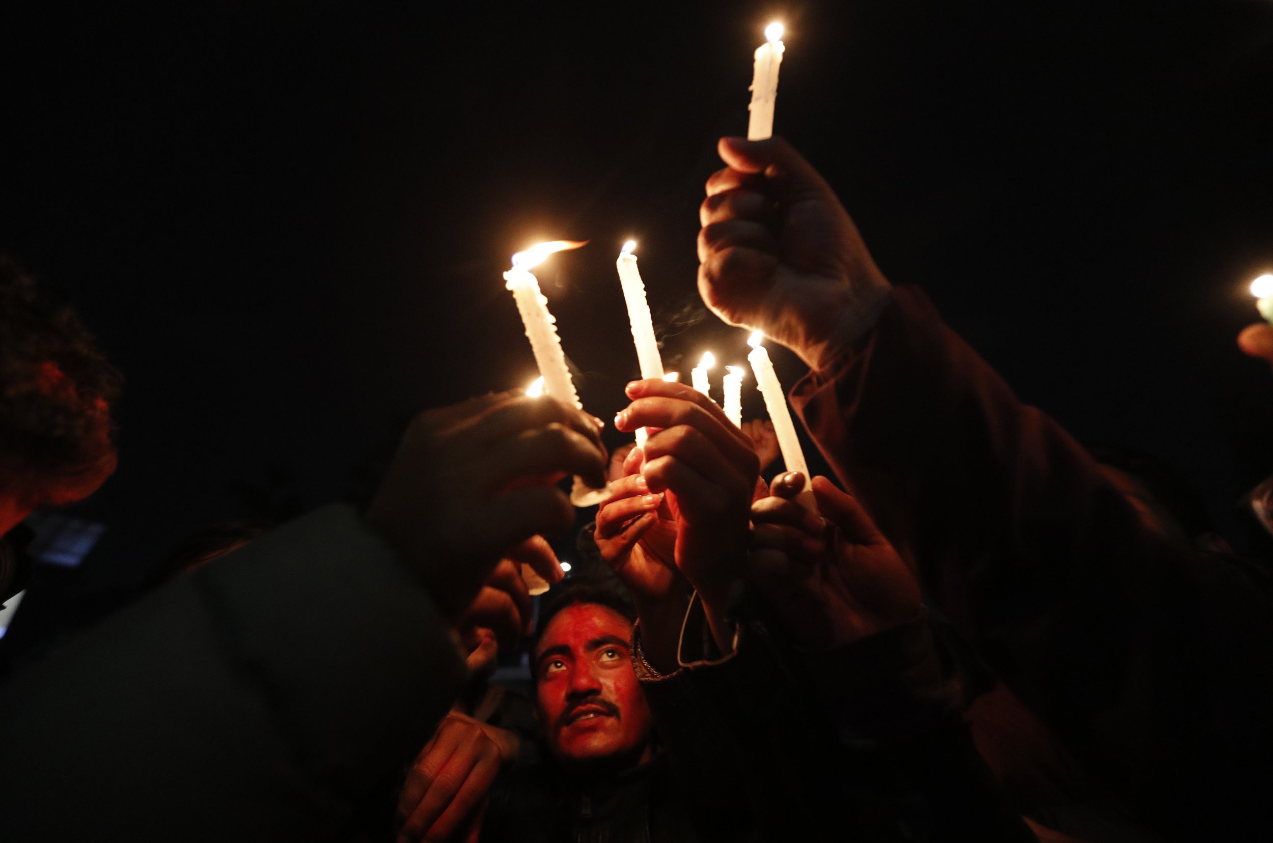  Nepalese supporters of the splinter group in the governing Nepal Communist Party celebrate on Feb. 23, 2021, in Kathmandu after the Supreme Court ordered the reinstatement of Parliament, which had been dissolved by the prime minister. (AP Photo/Nira