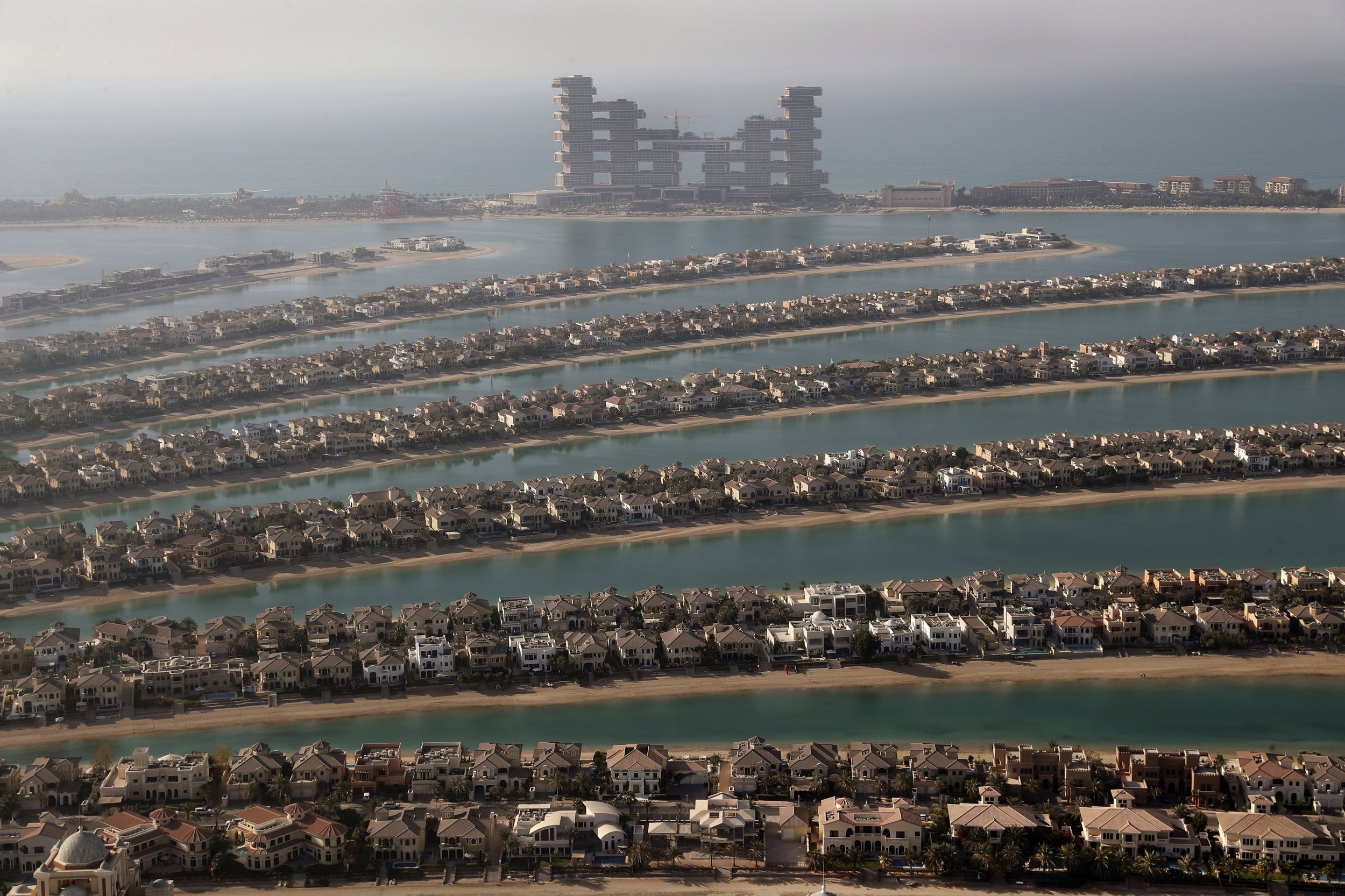  Villas on the fronds of the Jumeirah Palm Island in Dubai, United Arab Emirates, are seen from the observation deck of The View at The Palm Jumeirah on April 6, 2021. (AP Photo/Kamran Jebreili) 