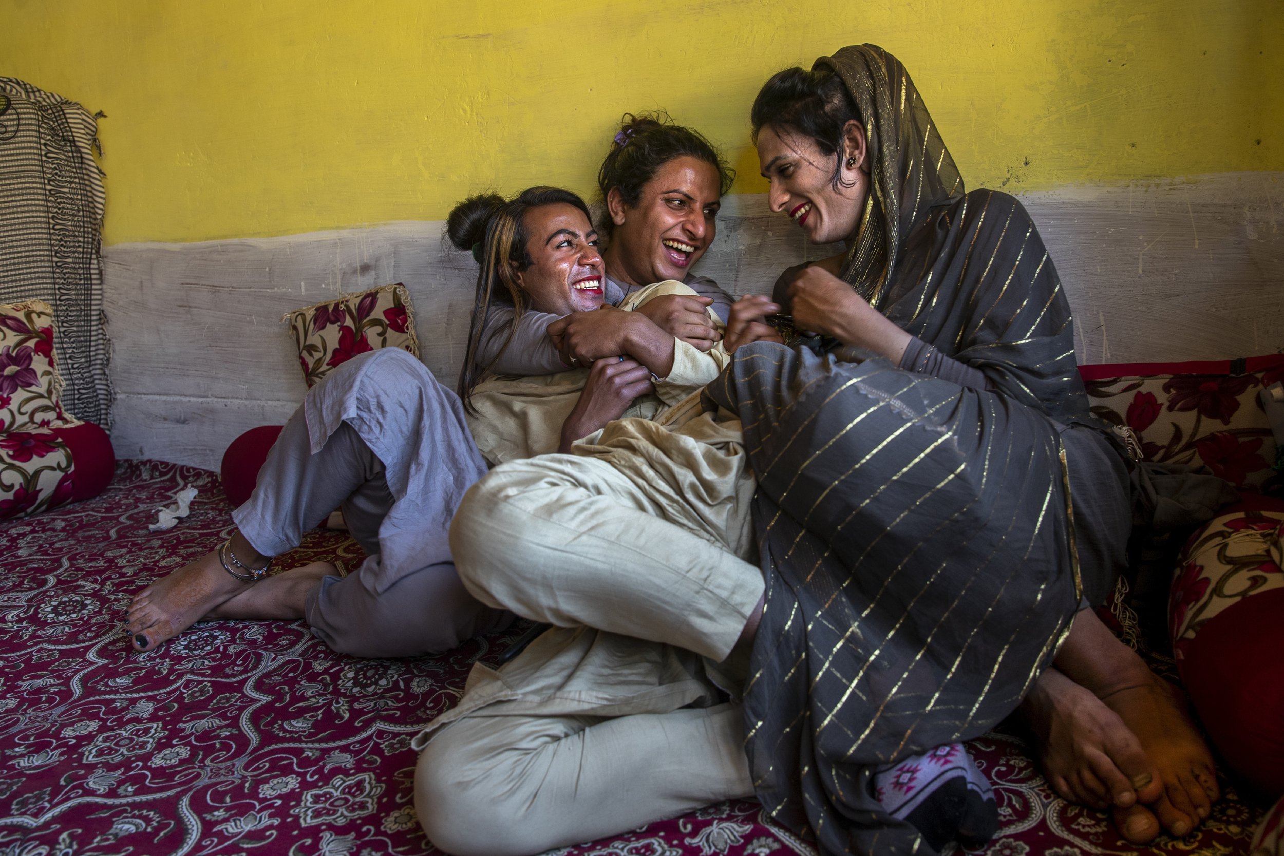  Khushi Mir, left, a transgender Kashmiri, relaxes with friends after a meeting of community members in the outskirts of Srinagar, Indian controlled Kashmir, on June 4, 2021. Khushi and four young boys have begun a volunteer group to distribute food 