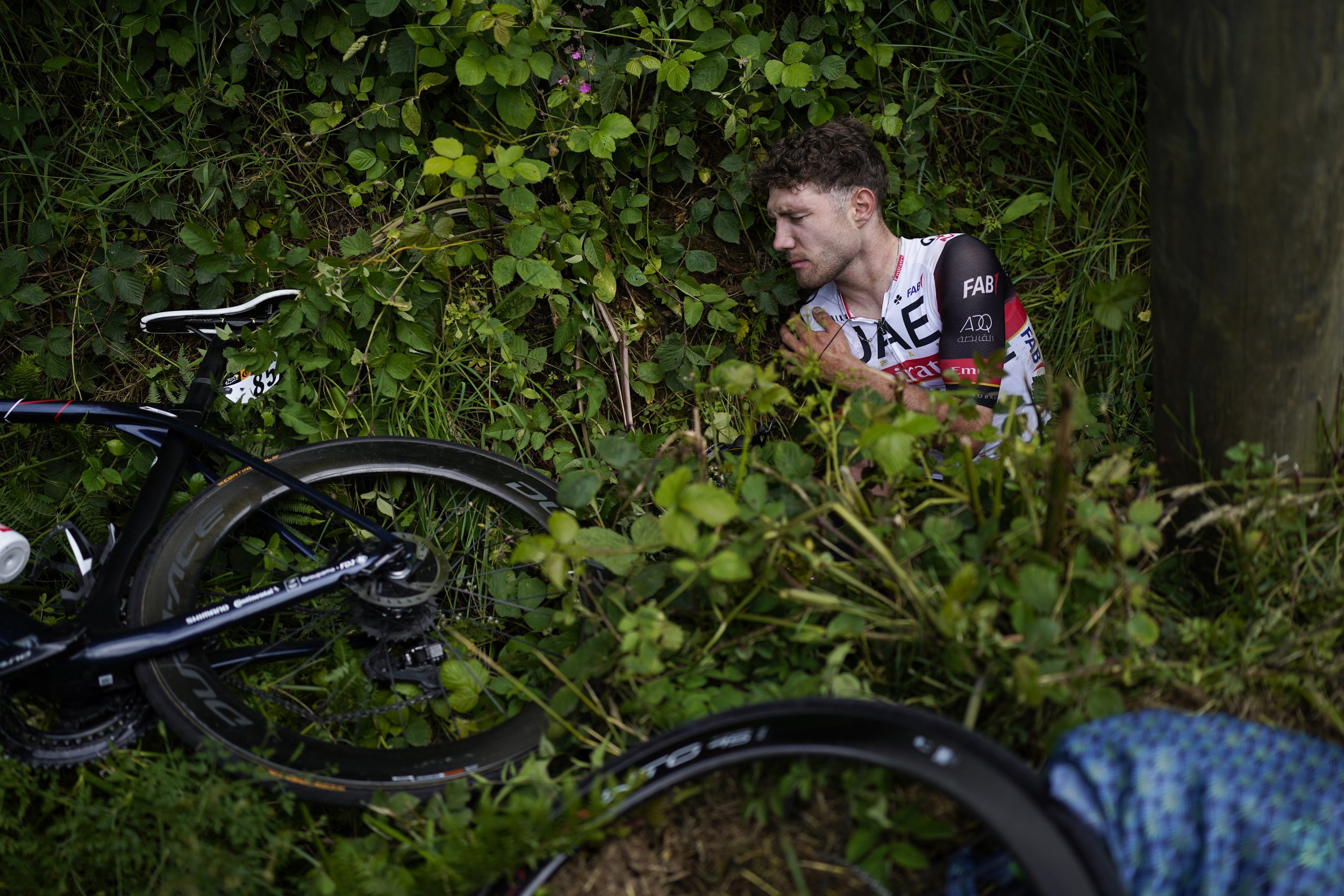  Switzerland's Marc Hirschi lies on the side of the road after crashing during the first stage of the Tour de France cycling race on June 26, 2021. (AP Photo/Daniel Cole) 