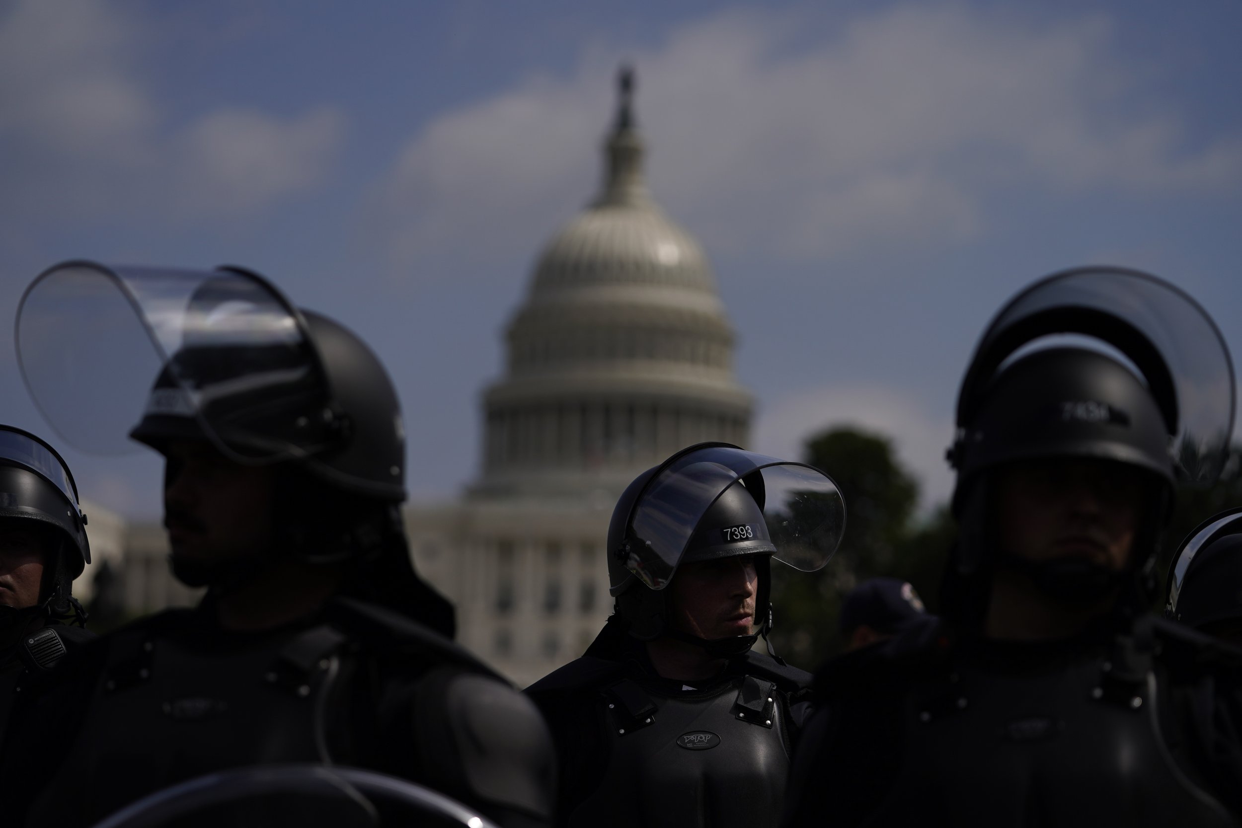  Police in riot gear patrol near the U.S. Capitol in Washington, on Sept. 18, 2021, during a rally by allies of former President Donald Trump to support what they call “political prisoners” from the Jan. 6 insurrection at the U.S. Capitol. (AP Photo/